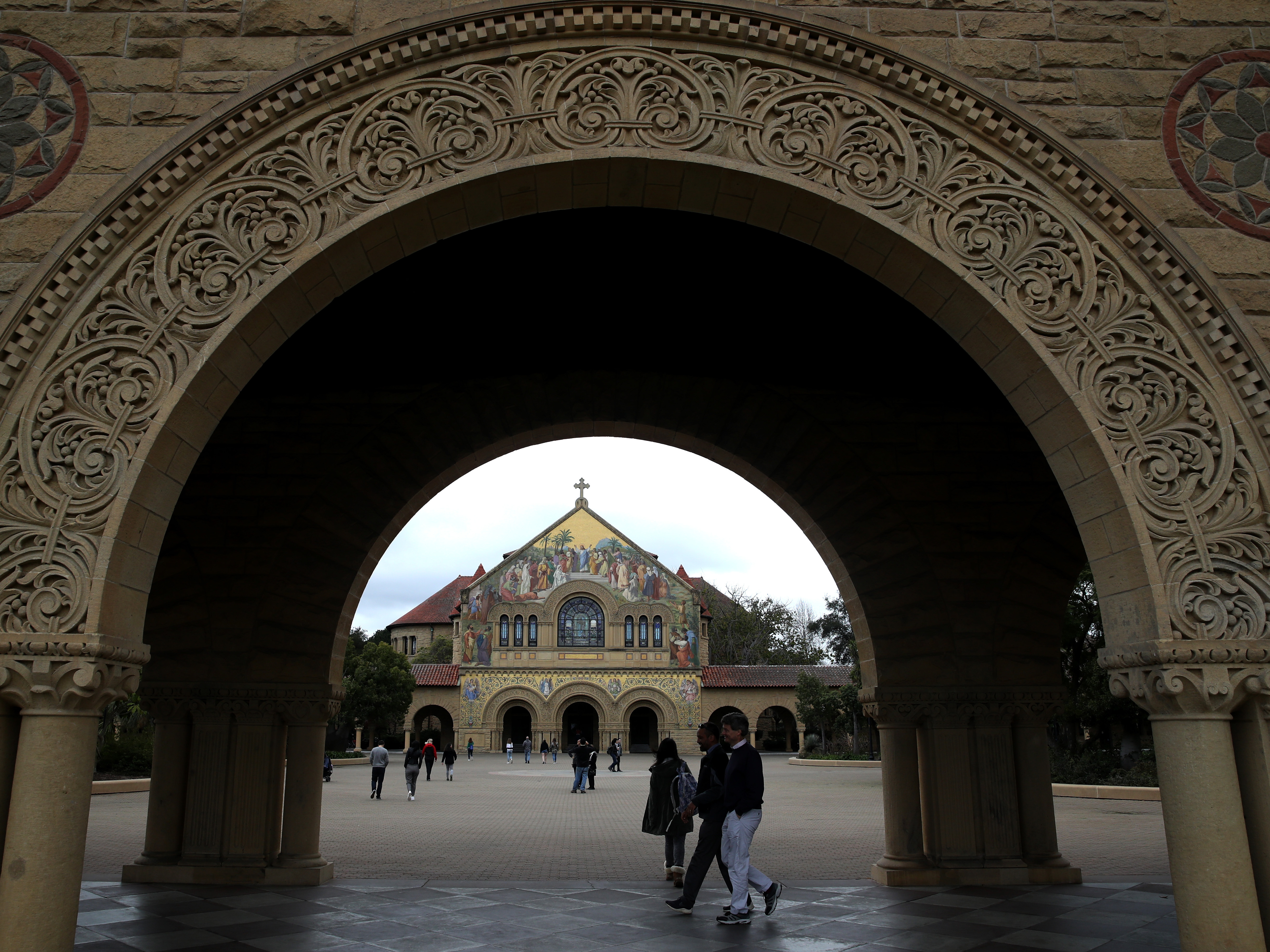 Students and visitors walk on Stanford University's campus in 2019. (Getty Images)