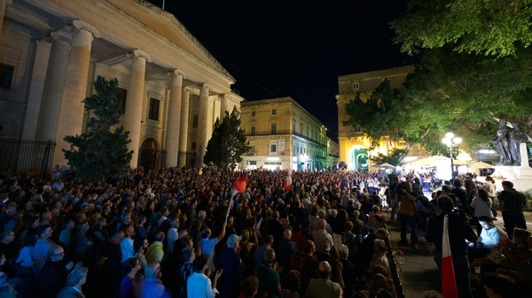 People attend a gathering to remember Daphne Caruana Galizia, at La Valletta, in Malta. Malta is marking the fifth anniversary of the car bomb slaying of the investigative journalist.