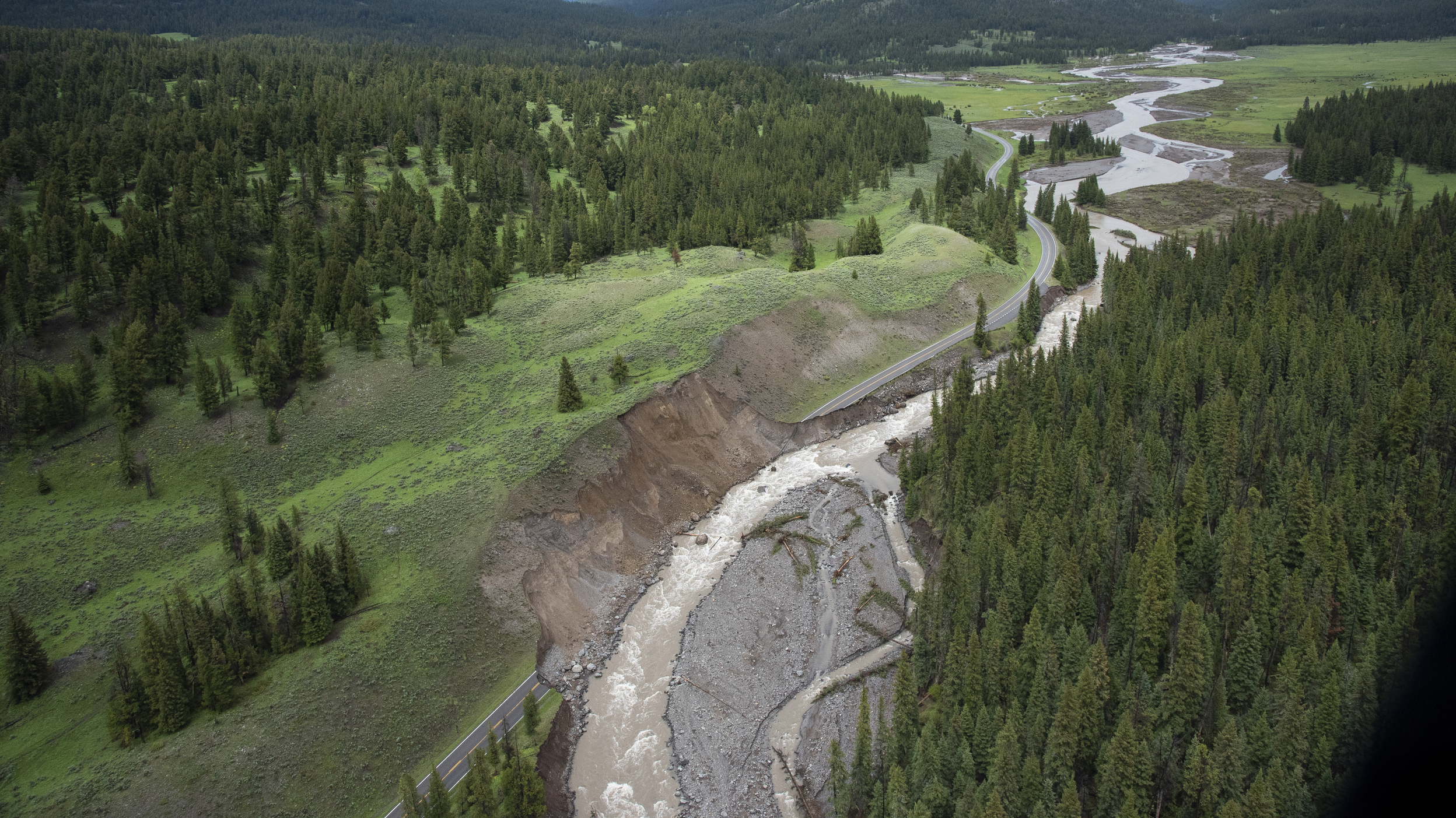 Yellowstone National Park has reopened an entrance devastated by June floods