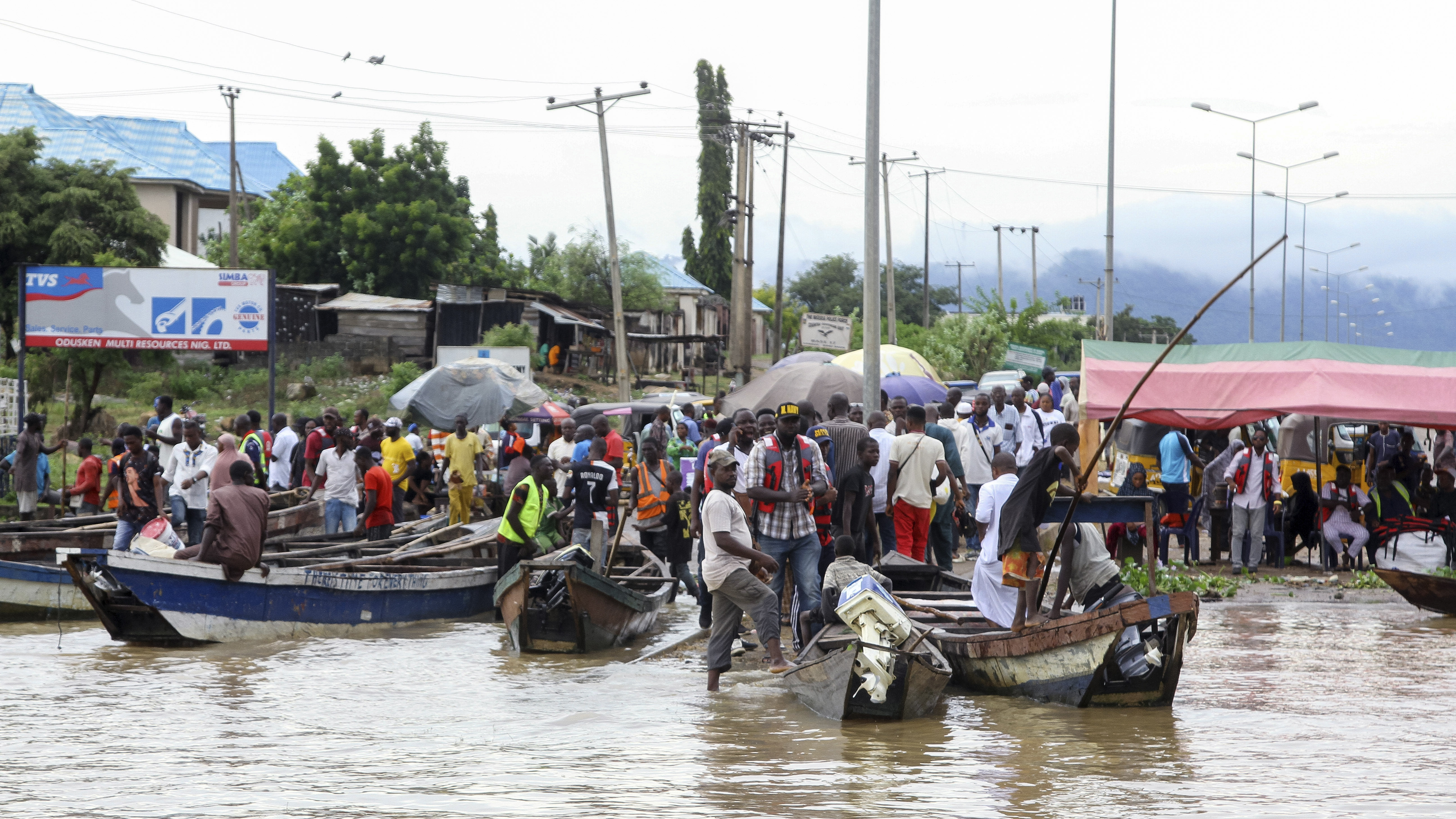 People stranded due to floods following several days of downpours In Kogi, Nigeria, on Oct. 6.