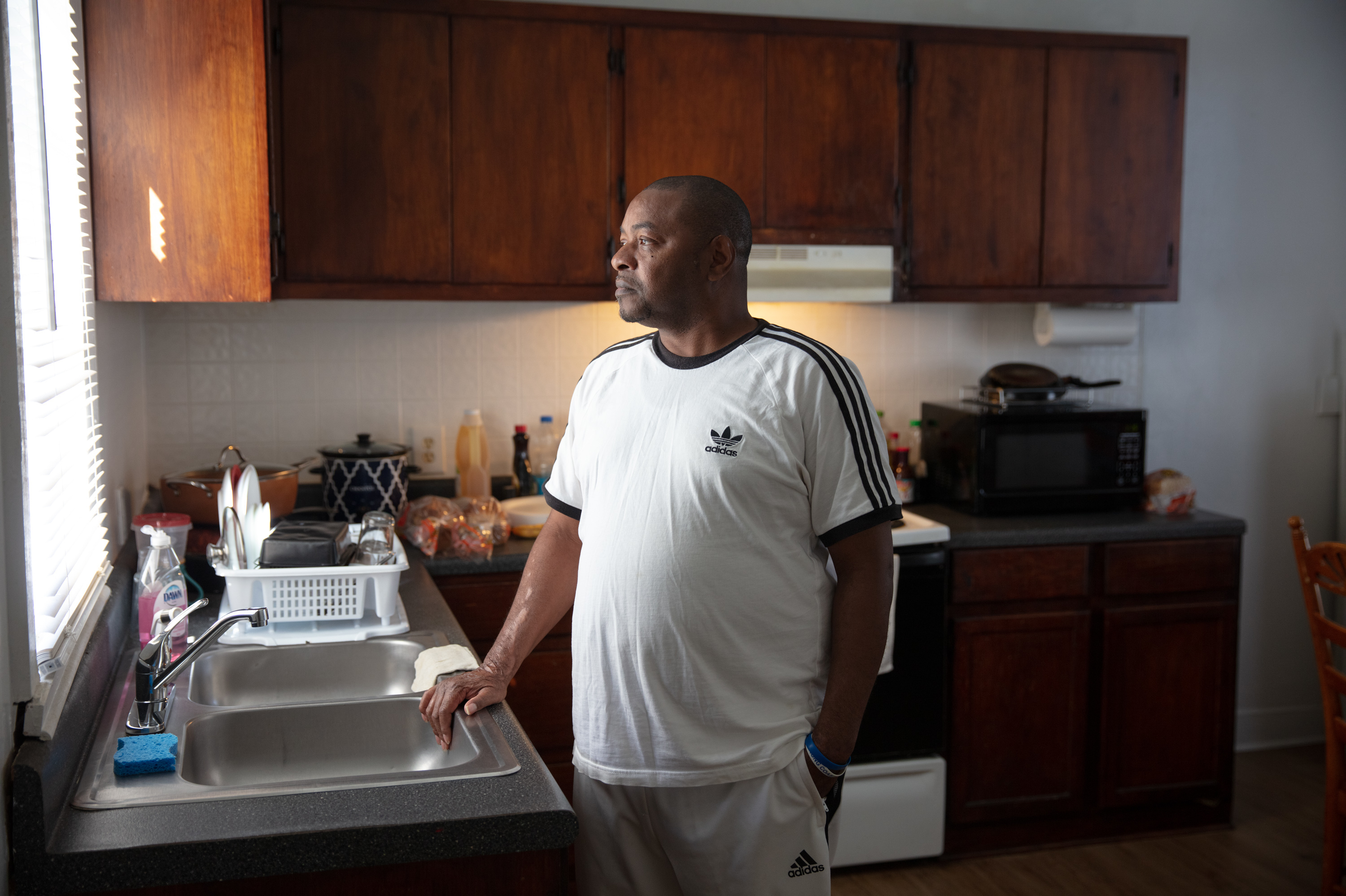 Eric Perkins says the kitchen is what sold him on the two-bedroom, one-bathroom apartment in Norfolk, Va., that he found through a shared housing program. (Parker Michels-Boyce for NPR)