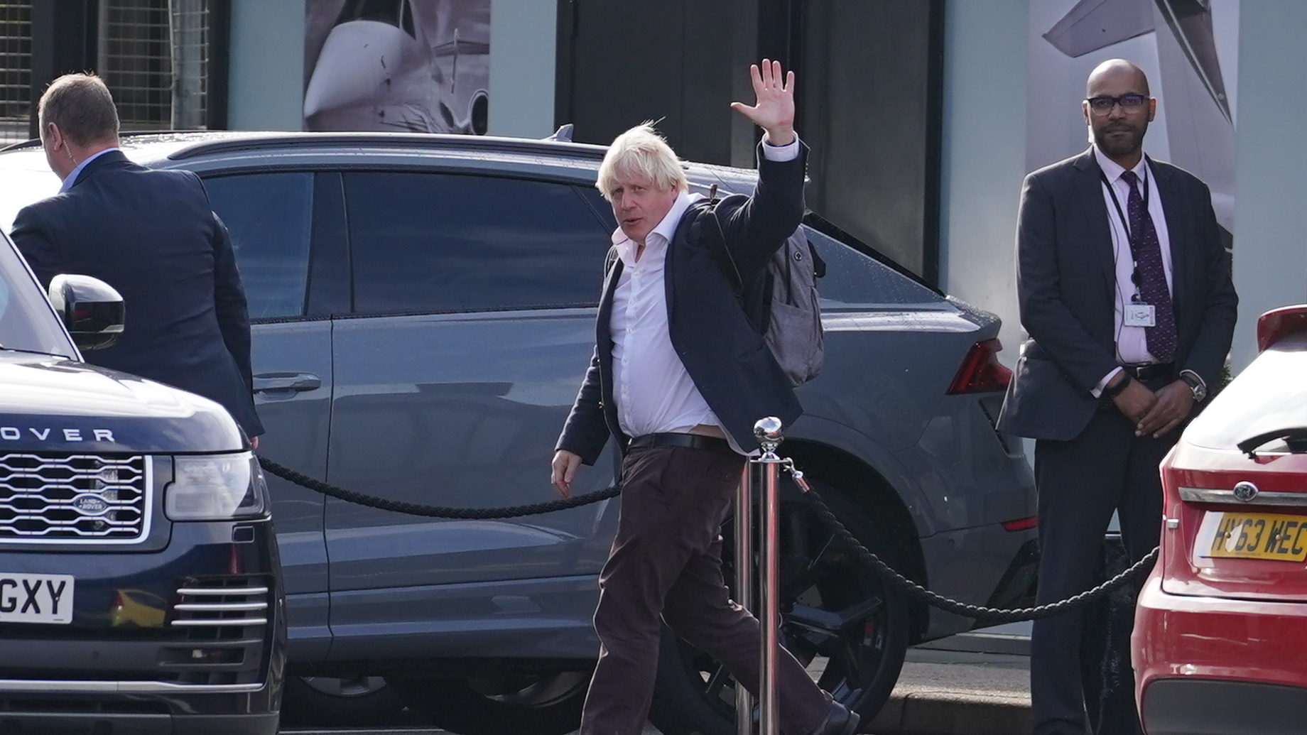 Former Prime Minister Boris Johnson arrives at Gatwick Airport in London on Saturday, after travelling on a flight from the Caribbean following the resignation of Liz Truss as prime minister.