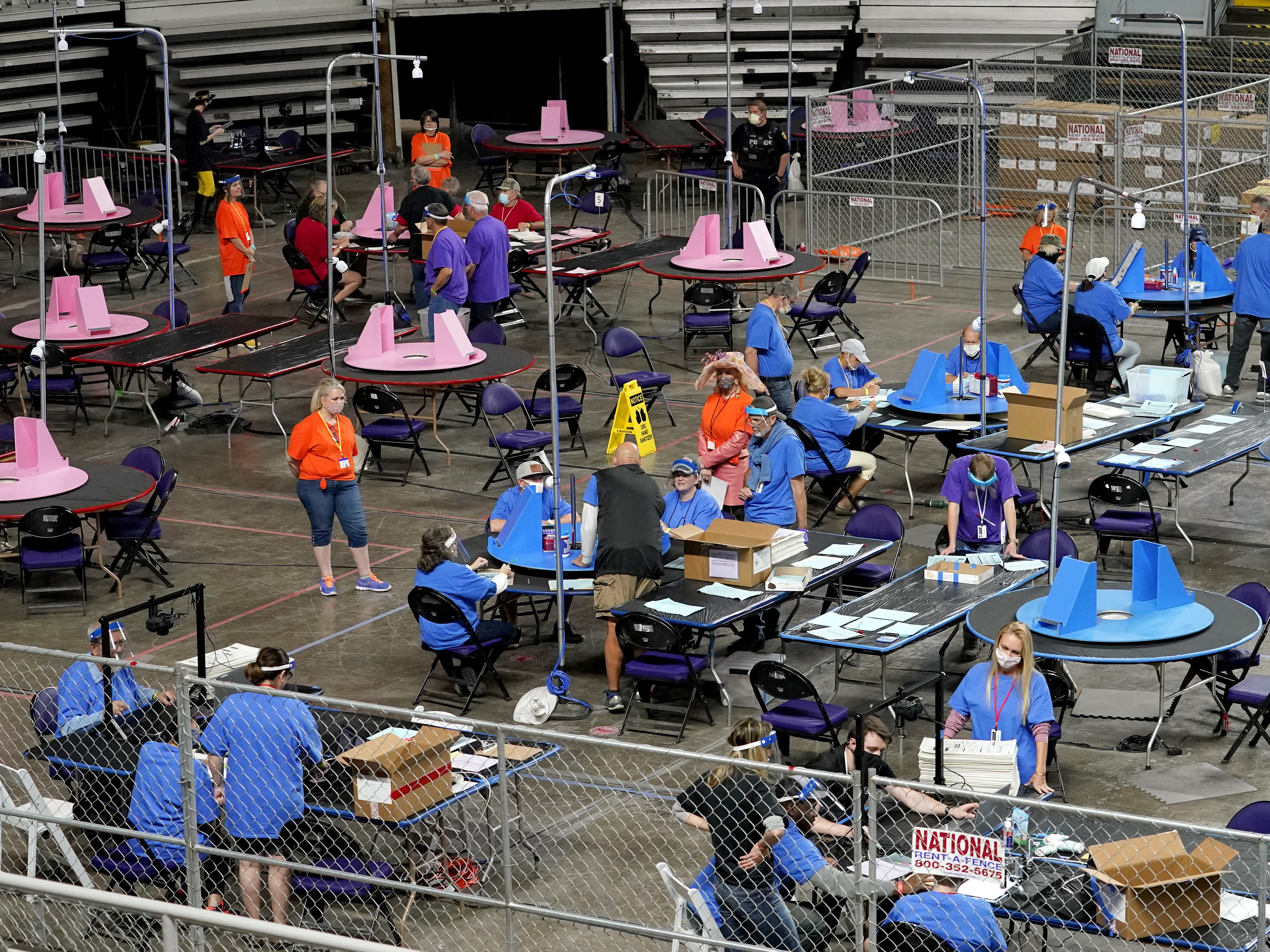 State legislative races are on the front lines of democracy this midterm cycle 1 In this May 6, 2021, file photo, Maricopa County ballots cast in the 2020 general election are examined and recounted by contractors working for Florida-based company Cyber Ninjas at Veterans Memorial Coliseum in Phoenix.