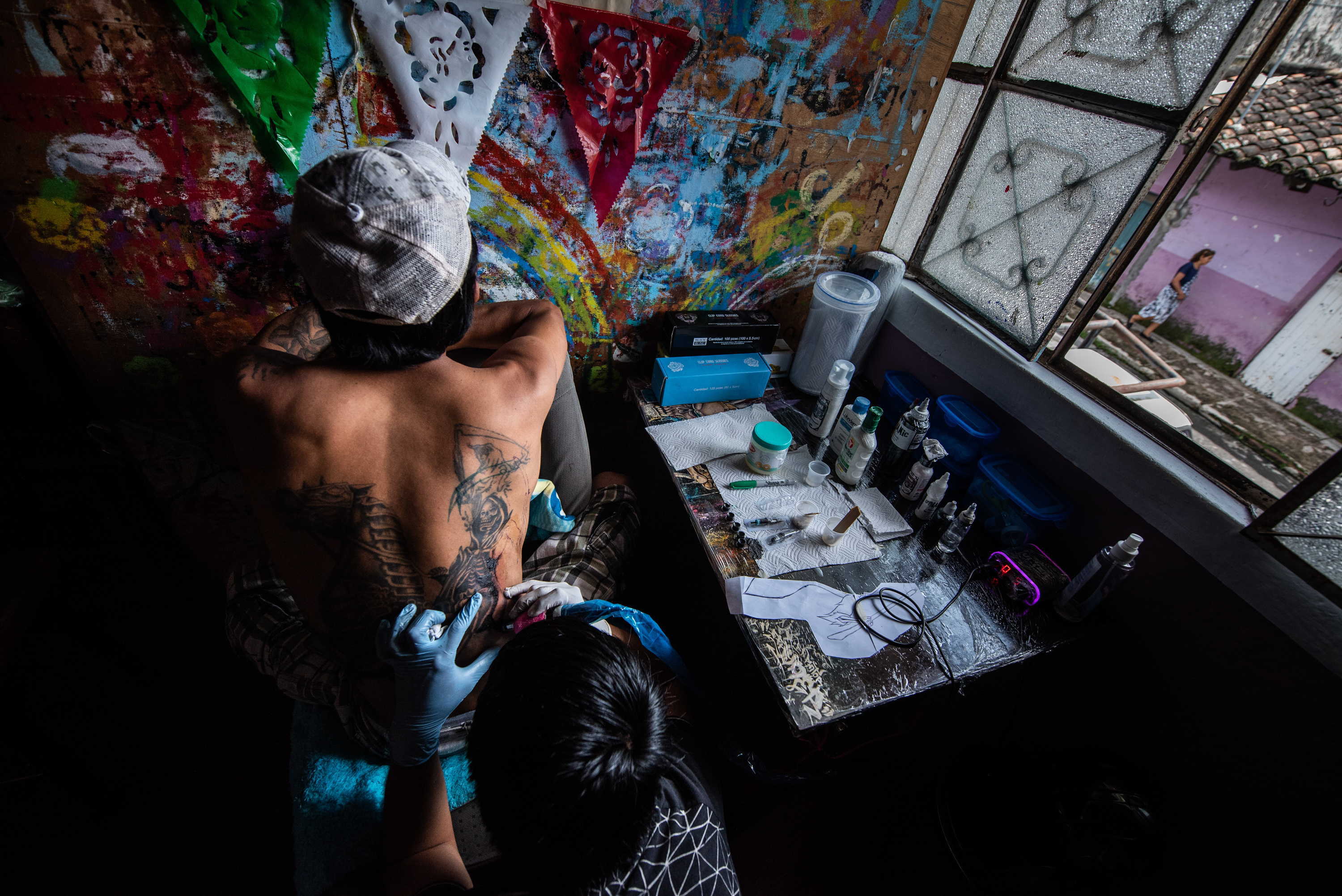 Beyond día de los muertos: The believers of Santa Muerte in Veracruz 7 Juanín gets a tattoo of Santa Muerte that covers his entire back.