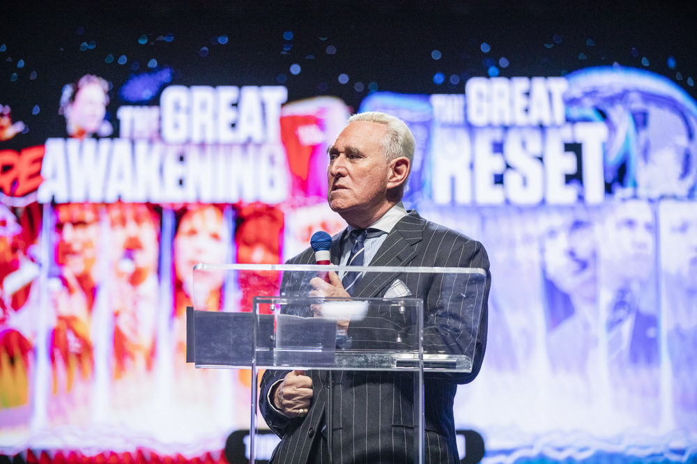 Former Trump political adviser Roger Stone speaks during the ReAwaken America Tour held at the Spooky Nook Sports complex in Manheim, Pa., on Oct. 21. (Amanda Berg for NPR)