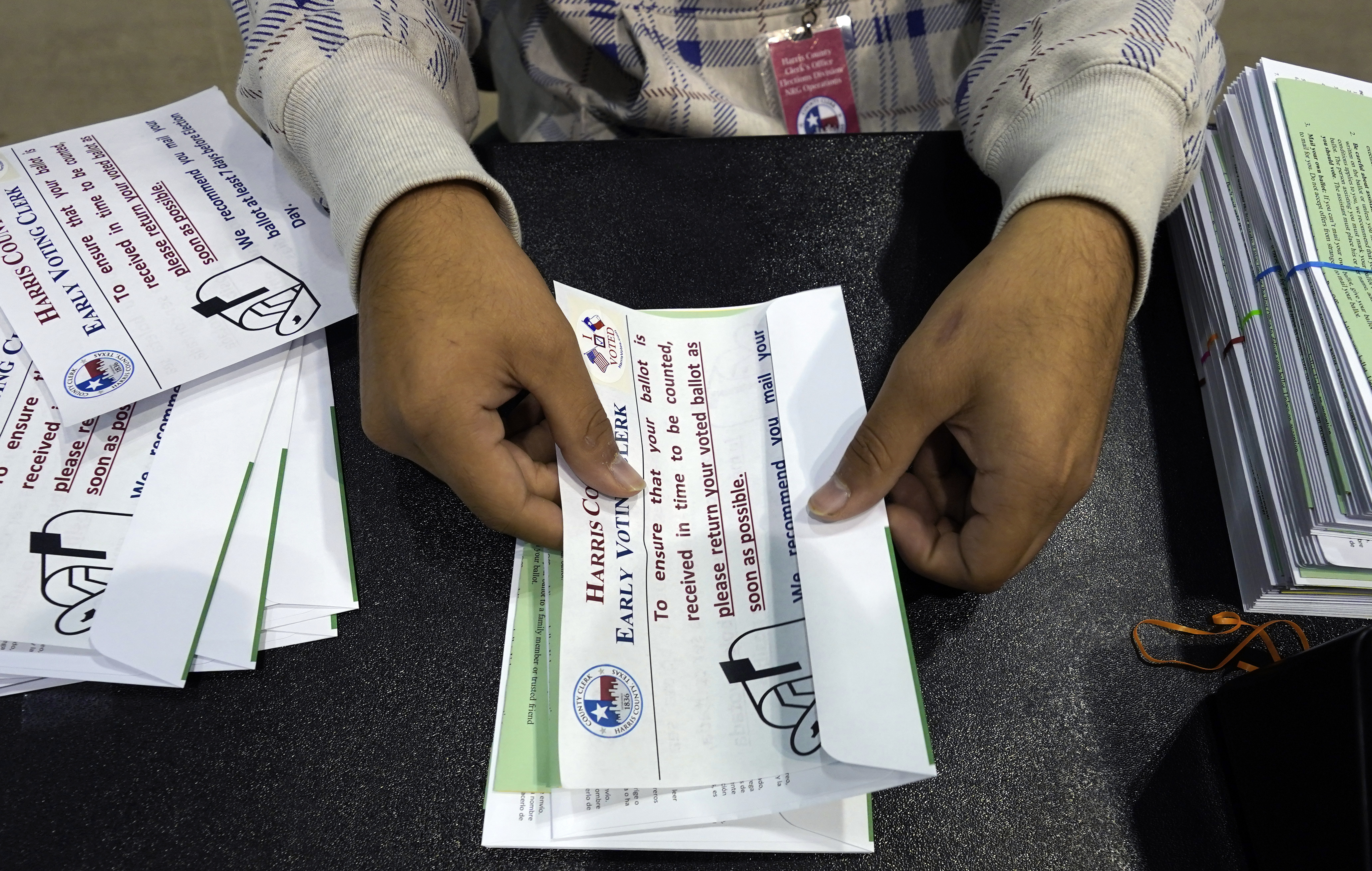 Texas officials say they're rejecting fewer mail ballots than the