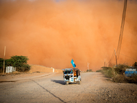 A tuktuk drives during a sandstorm in Somalia in April. The United Nations says a multi-year drought in East Africa is evidence of "mounting and ever-increasing climate risks."