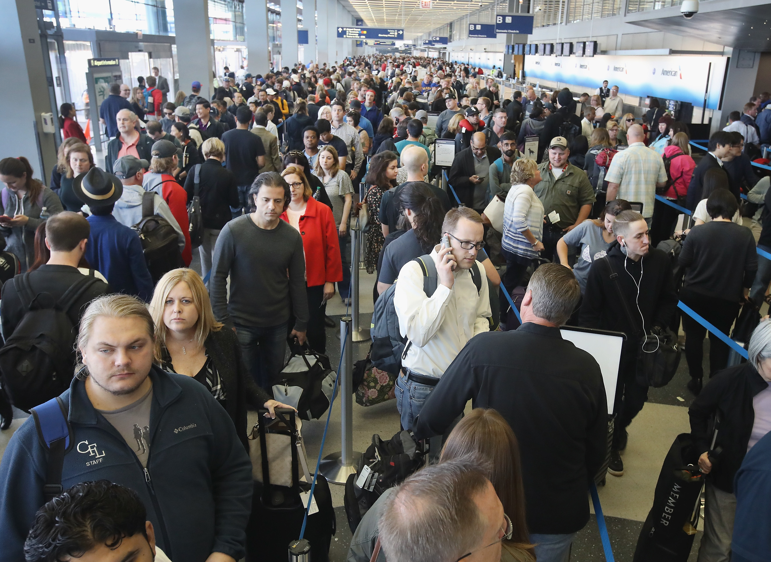 Passengers at O'Hare International Airport, in Chicago, wait in line to be screened at a Transportation Security Administration checkpoint in 2016. (Getty Images)