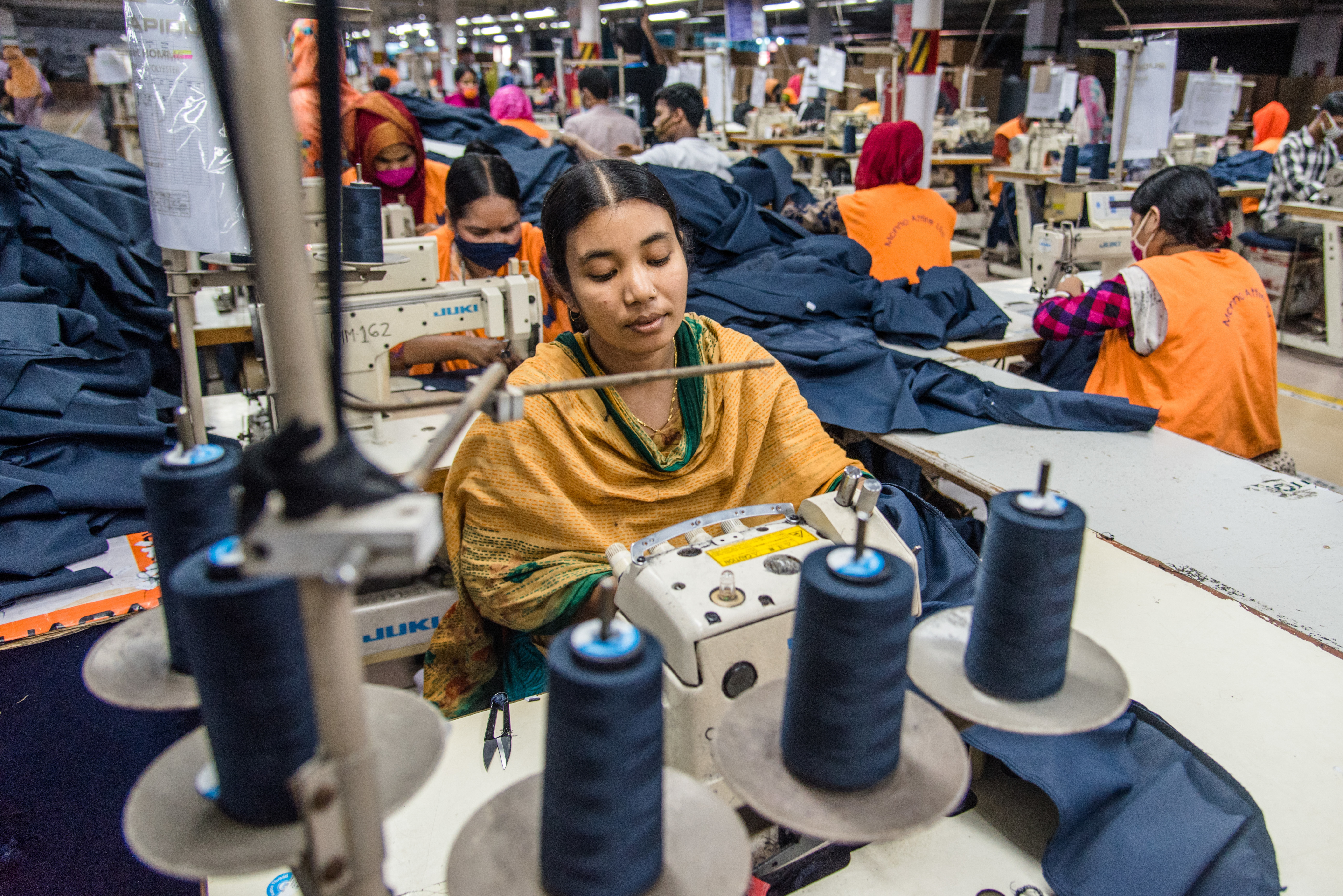 Women manufacture clothes in Dhaka, Bangladesh on Aug. 29. The ready-made garment (RMG) industry in Bangladesh is now a mainstay of the country's economy. Today, Bangladesh is one of the world's largest garment exporters, with the sector accounting for more than 80% percent of Bangladesh's exports. (Mustasinur Rahman Alvi/Eyepix Group/Future Publishing/Getty Images)