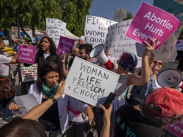 People argue as a group of anti-abortion rights protesters crashes the Women's March Action Rally for Reproductive Rights at Mariachi Plaza in Los Angeles on Oct. 8.