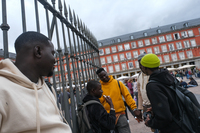 Four young men from Senegal sell bracelets in Madrid on October 20.