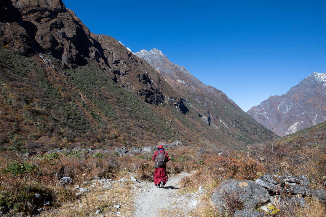 A young man walks through the Rolwaling Valley.