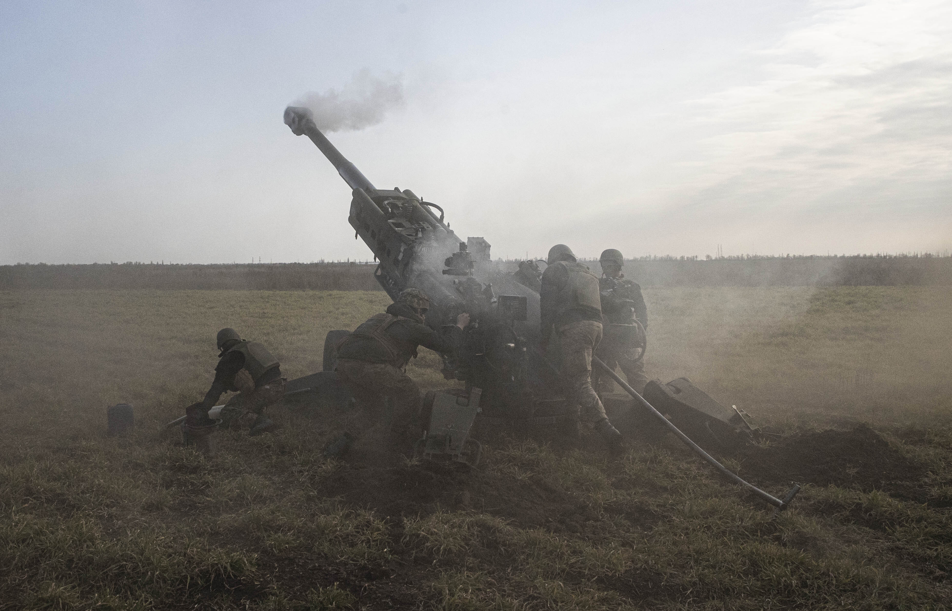 The Ukrainian artillery battery of the 59th Mechanized Brigade fires a howitzer at points controlled by Russian troops in Kherson Oblast, Ukraine on Saturday. (Metin Aktas/Anadolu Agency/Getty Images)
