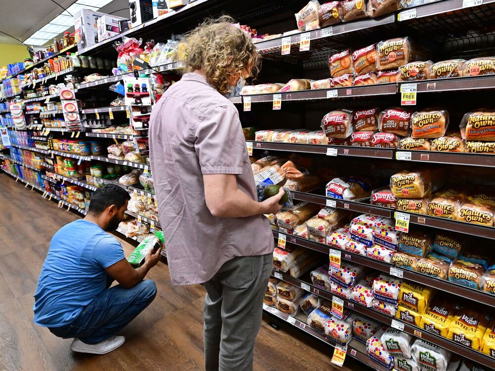 People shop for bread at a supermarket in Monterey Park, California on October 19, 2022. Grocery prices were up 12.4% last month from a year earlier, a government report showed. (AFP via Getty Images)