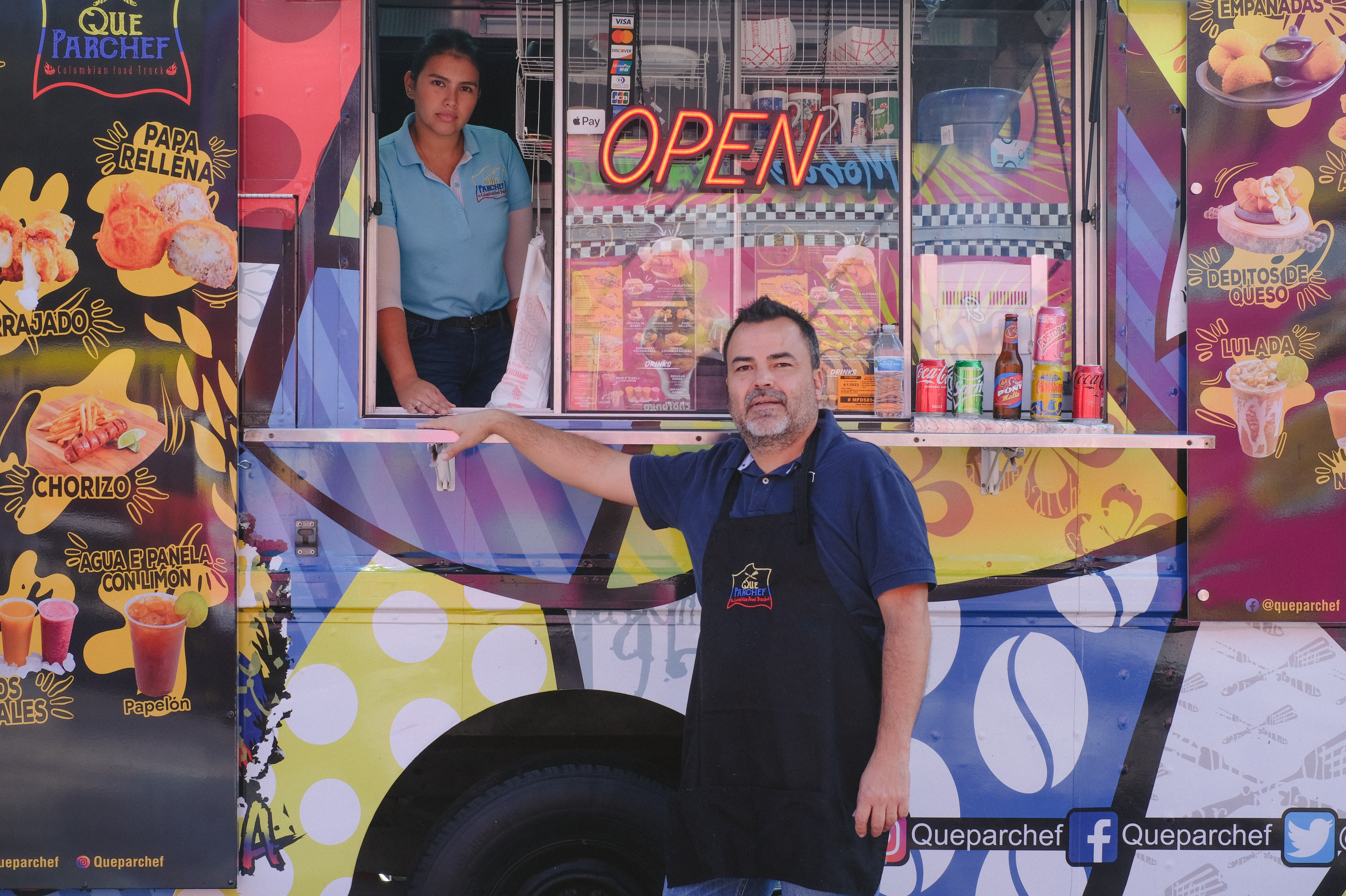 Paulo Echeverry and Dahianara Lopez Zapata, at their food truck in Kissimmee, Fla. (Michelle Bruzzese for NPR)