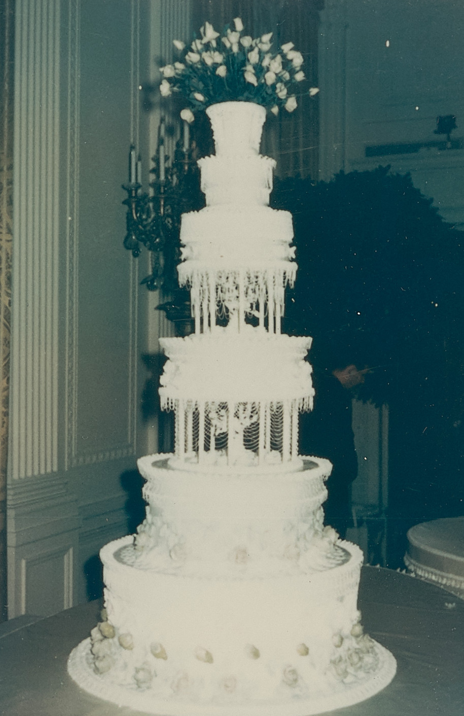 Johnson's wedding cake was designed by Clement Maggia, a renowned pastry chef from the Greenbrier Hotel in West Virginia. However, Maggia suddenly died of a heart attack three days before the wedding. The 6-foot-tall cake was ultimately assembled by Eric Crane, another pastry chef from the hotel.