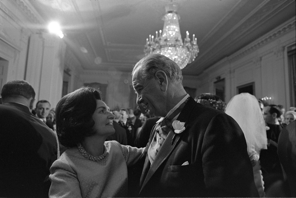 President Lyndon B. Johnson dancing with first lady Lady Bird Johnson at their daughter Lynda Bird Johnson's wedding reception in the East Room.
