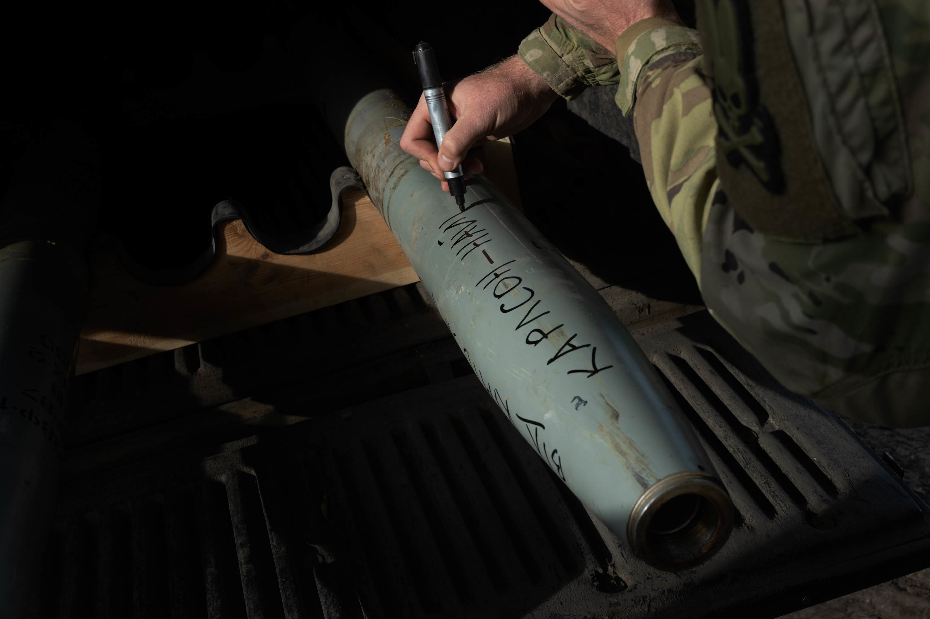 With winter approaching, Ukraine prepares to fight on frozen ground 1 A Ukrainian soldier writes on a rocket before loading it to fire in the Russian-occupied Kherson region in October.