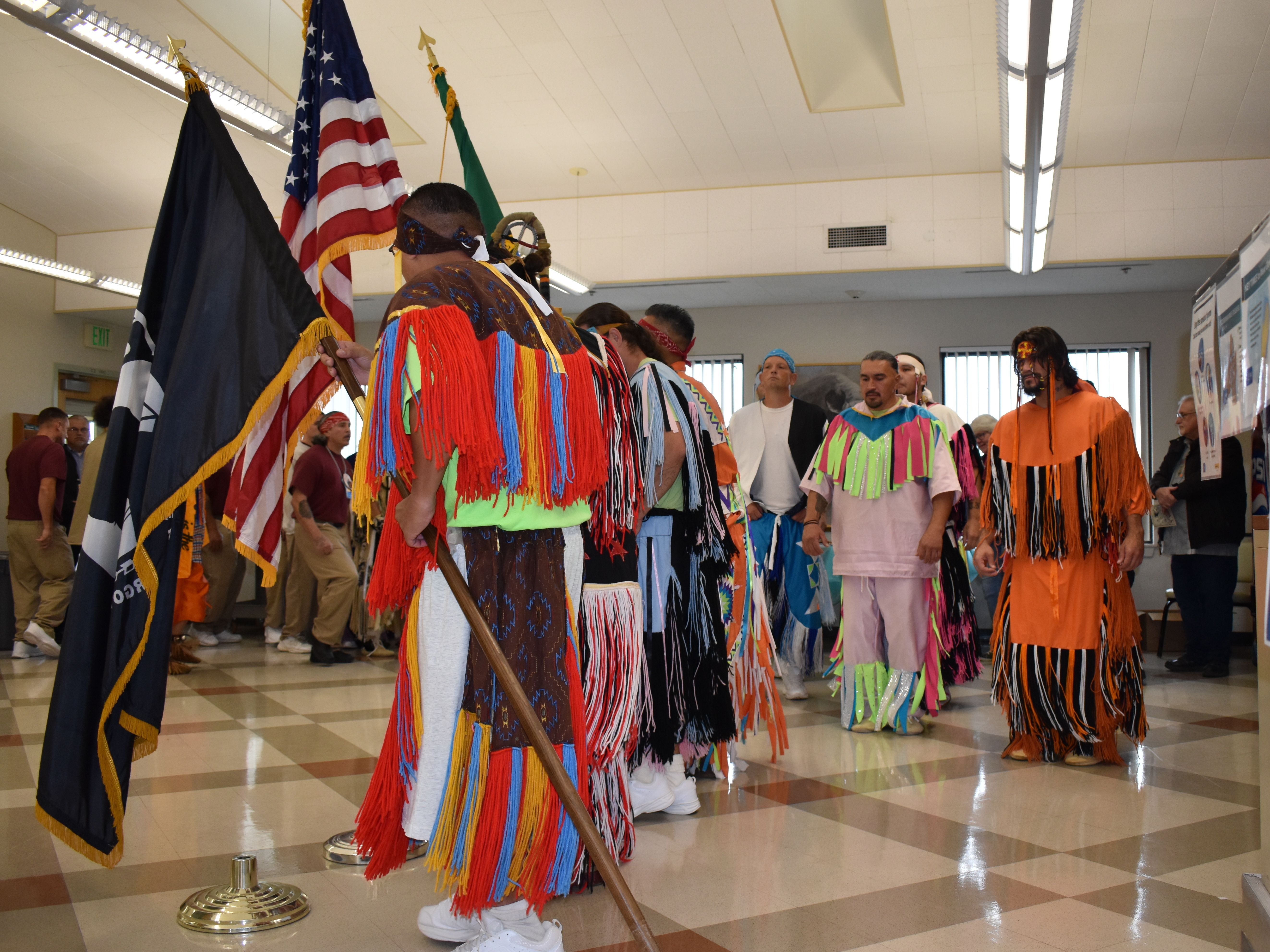 Dancers make their grand entry into a meeting room at the start of a powwow in late October at the Airway Heights Corrections Center, near Spokane, Wash. (Doug Nadvornik)