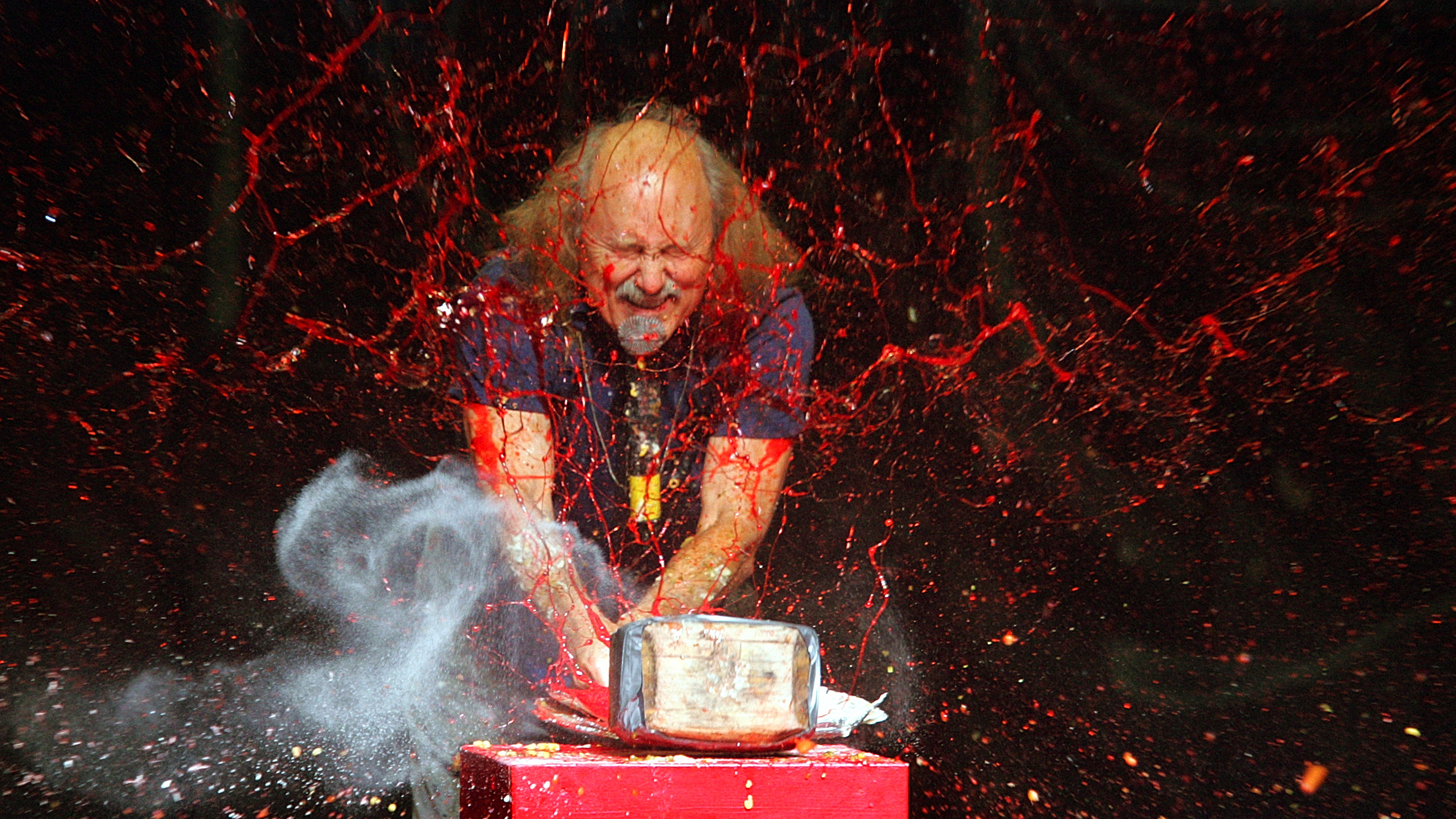Comedian Gallagher smashes strawberry syrup and flour at the end of his performance at the Five Flags Theater in Dubuque, Iowa, on Nov. 18, 2006.