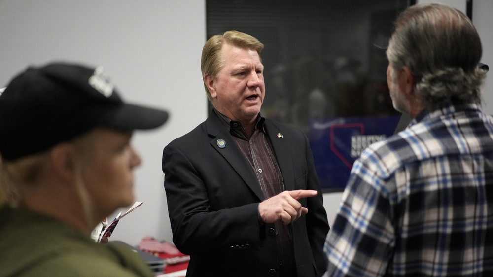 Jim Marchant, center, GOP nominee for secretary of state in Nevada, lost his election and also underperformed fellow Republicans running for U.S. senator and governor. (AP)