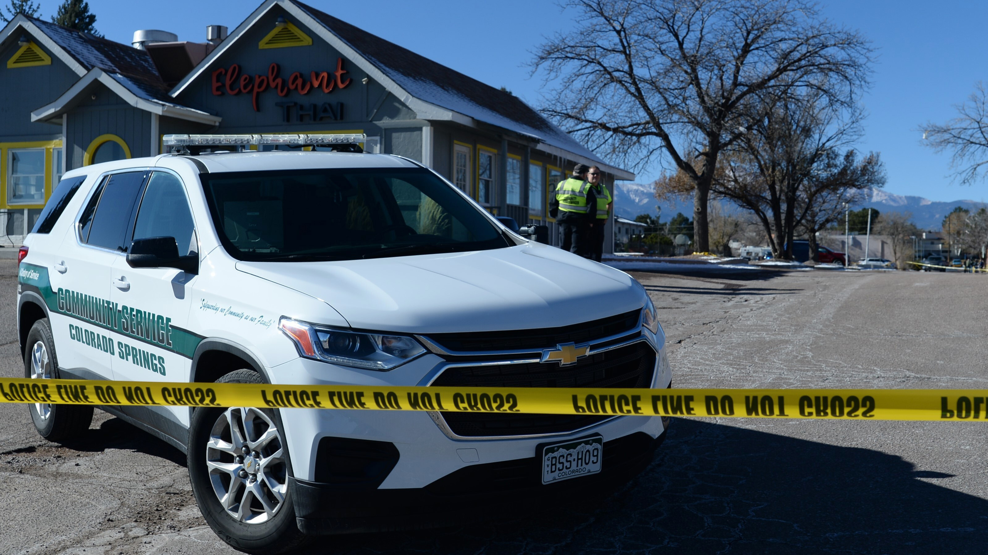 A Colorado Springs community service vehicle is parked Sunday near a gay nightclub in Colorado Springs, Colo., where a shooting occurred late Saturday night.