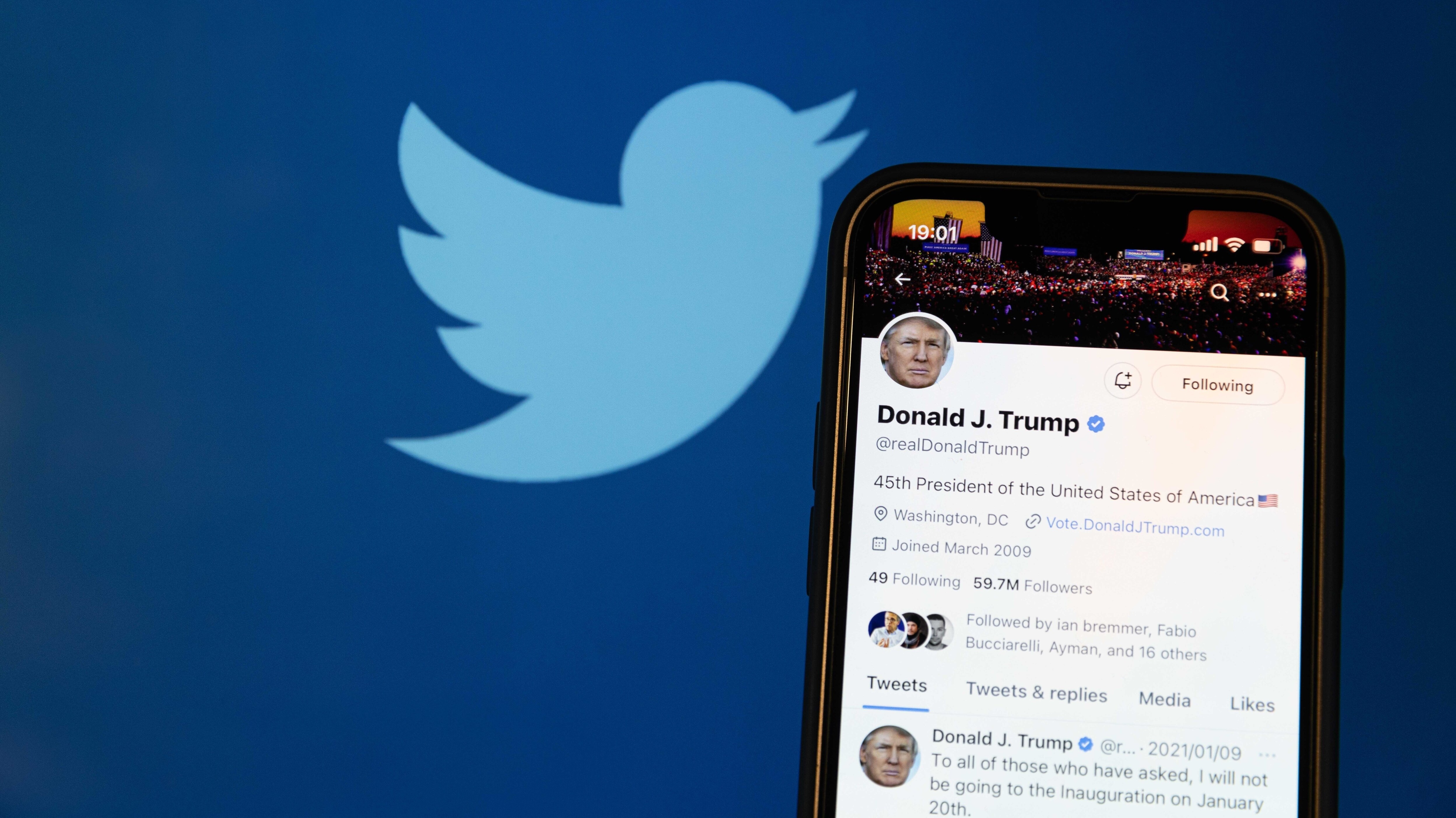 A photo illustration shows the reactivated Twitter profile of former US President Donald Trump. Elon Musk reinstated him on the social media platform on November 19, 2022.