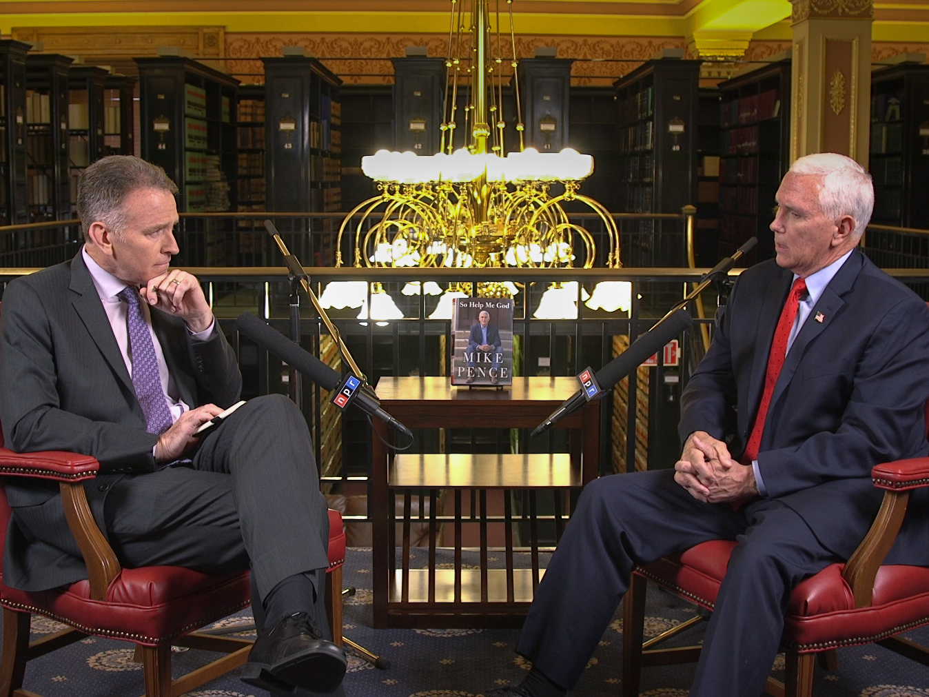 Former Vice President Mike Pence (right) speaks with <em>Morning Edition</em> co-host Steve Inskeep at the law library of the Indiana state capitol in Indianapolis on Monday. (NPR)