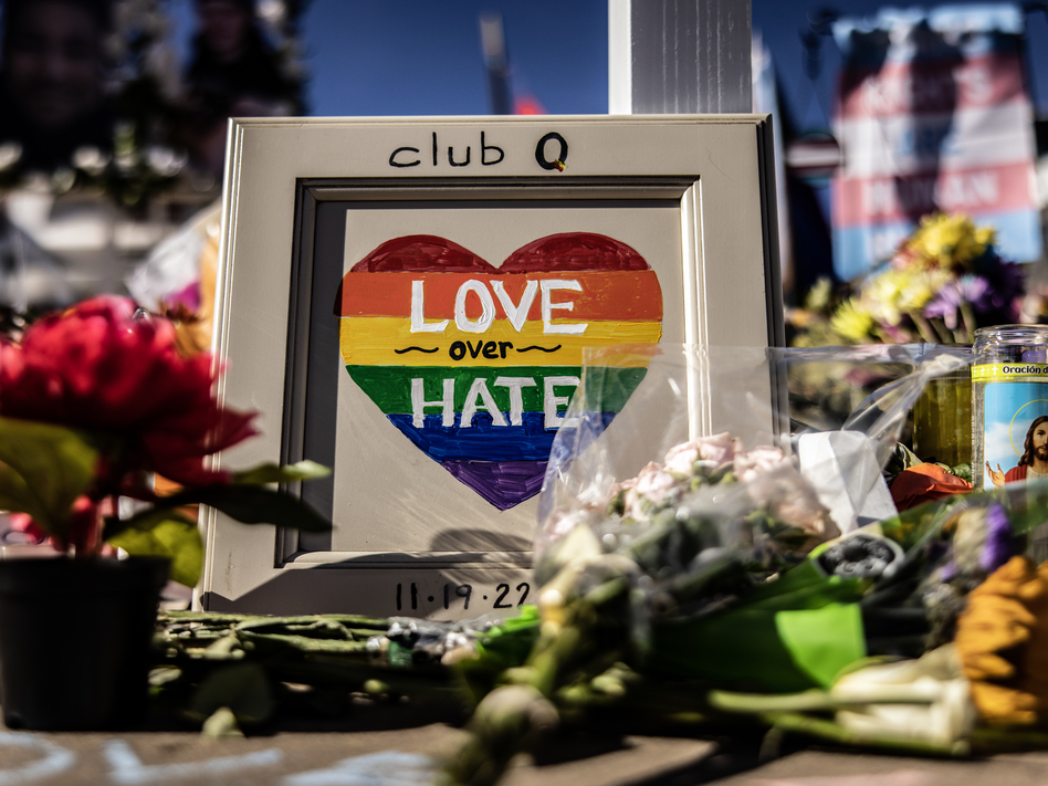 A part of a memorial is seen outside of Club Q on Tuesday in Colorado Springs, Colo. A gunman opened fire inside the LGBTQ+ club on Saturday, killing five people.