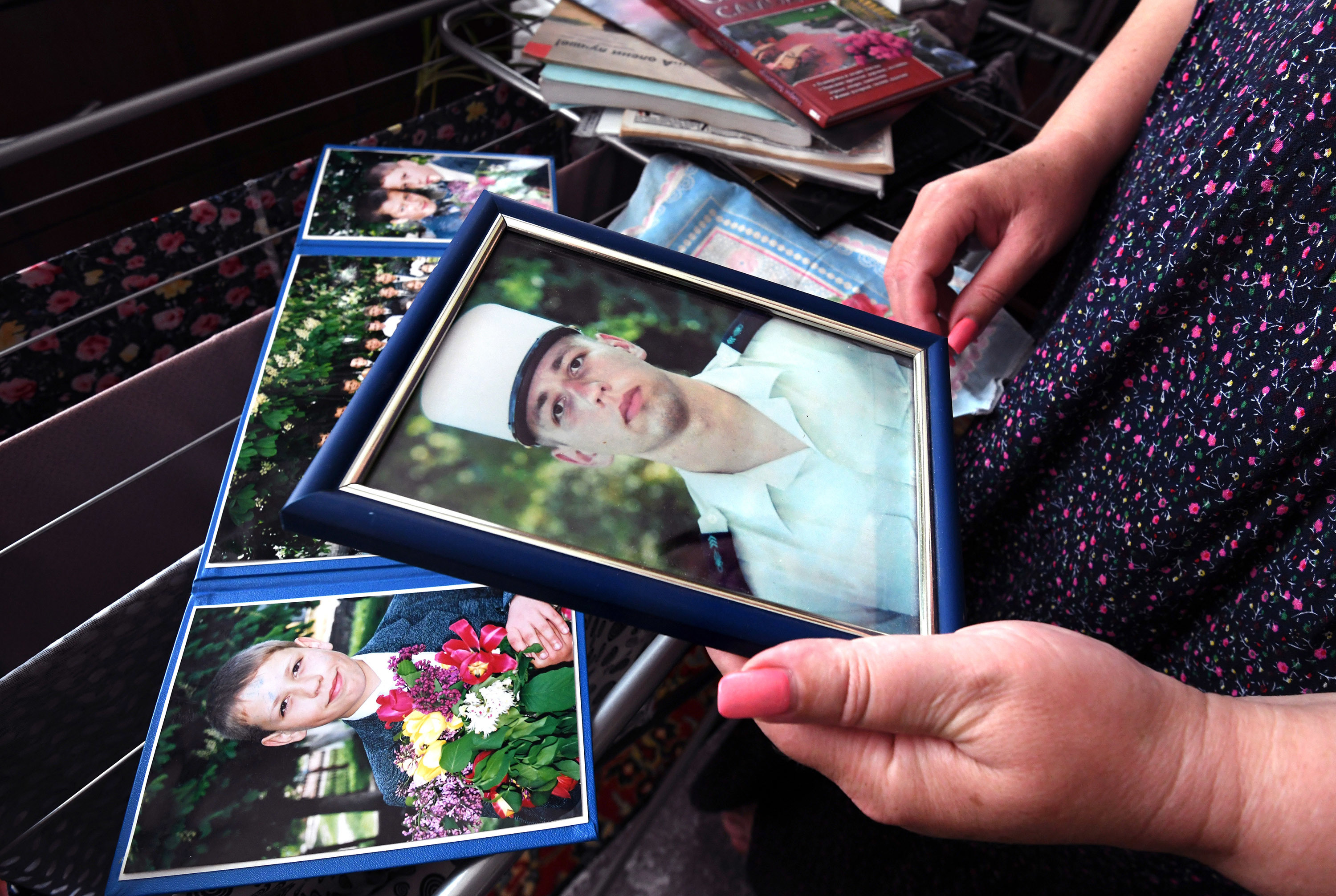 There have been 50,000 alleged war crimes in Ukraine. We worked to solve one 5 Oksana holds a photo of Oleksandr in his French Foreign Legion uniform.