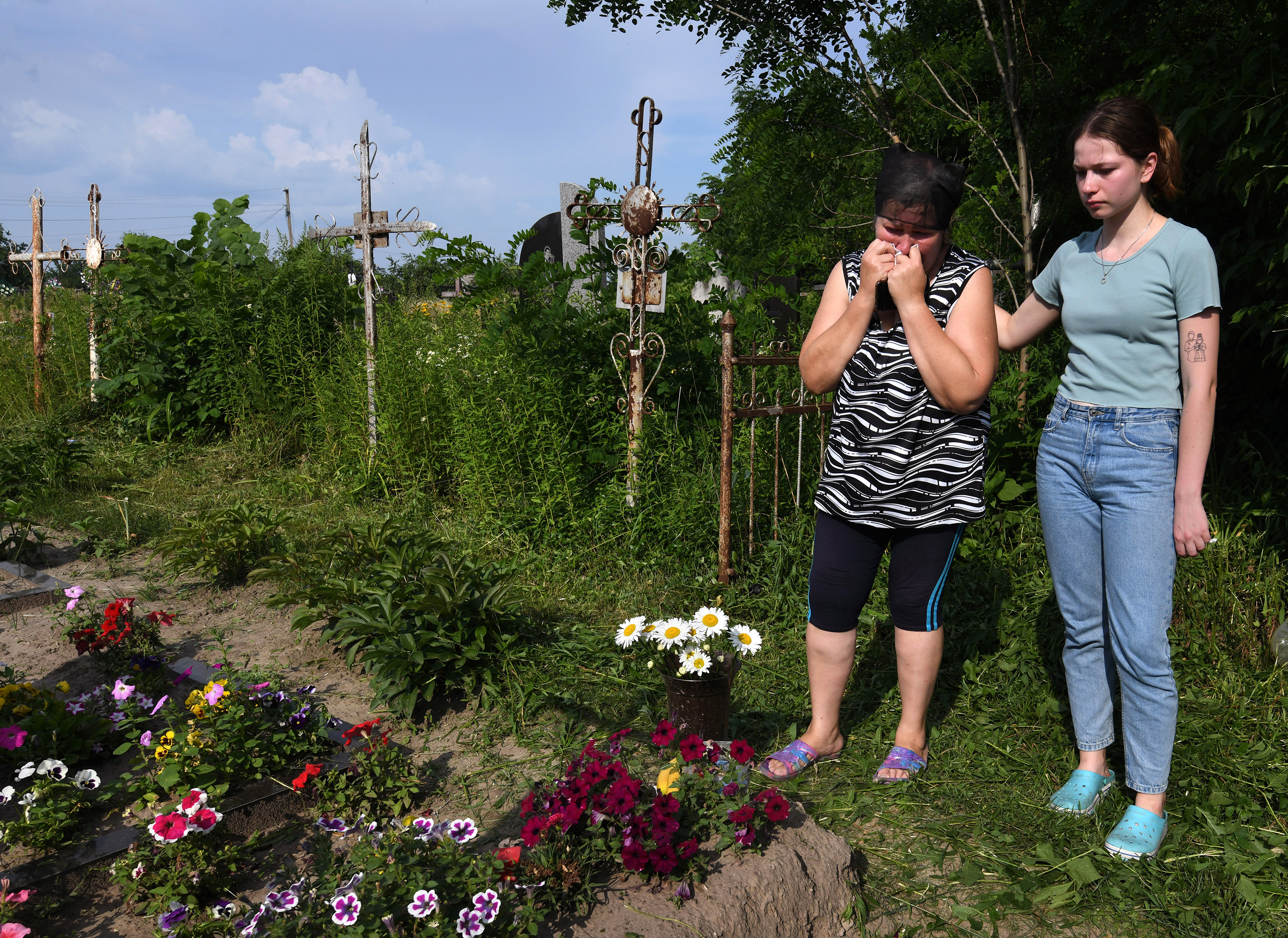 There have been 50,000 alleged war crimes in Ukraine. We worked to solve one 15 Oksana and Anya Breus visit Oleksandr's grave four months after he was killed.