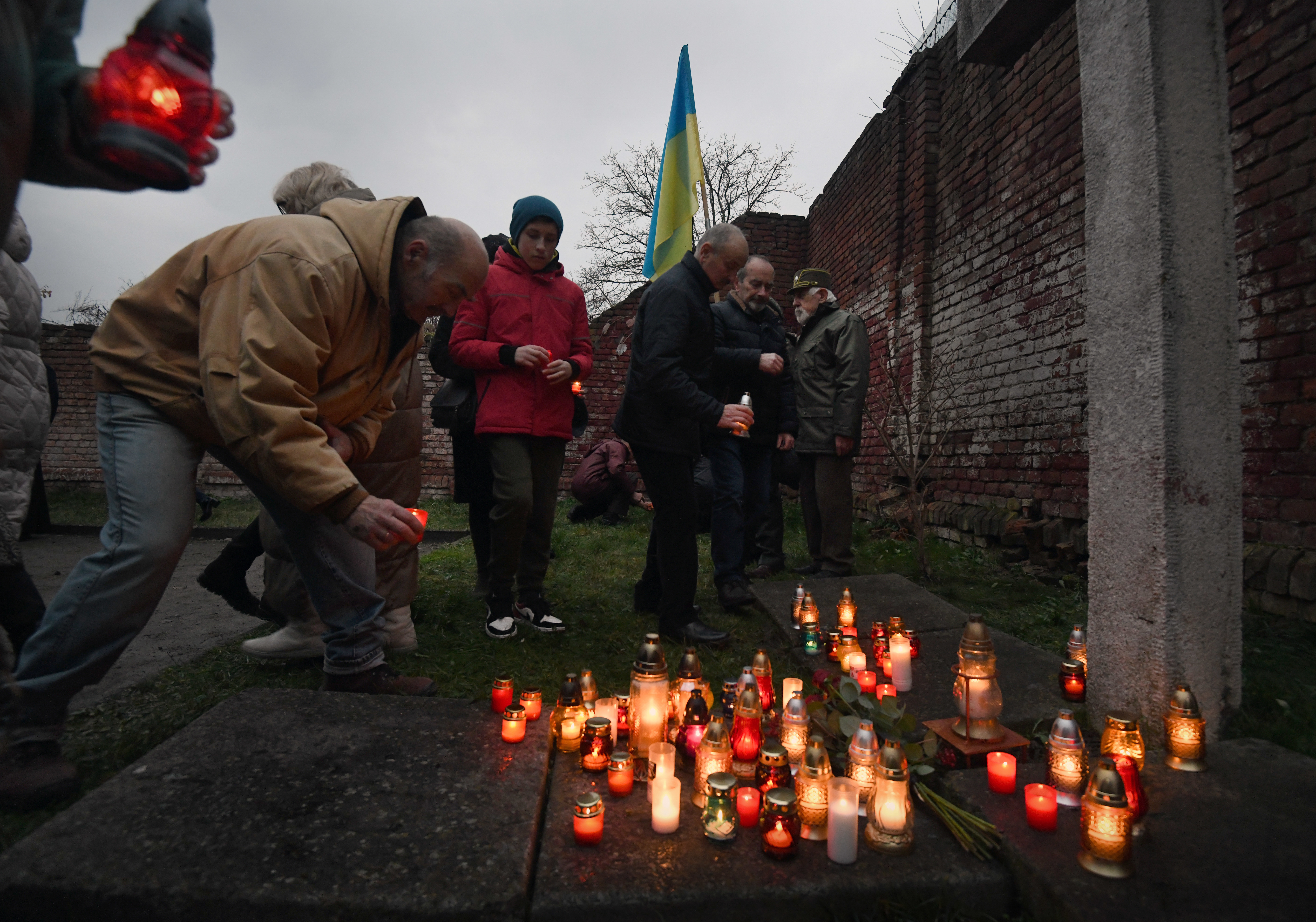 Residents hold a remembrance ceremony during the 90th anniversary of a great famine known as the Holodomor, at a museum in Drohobych, Ukraine, on Saturday. (Carol Guzy for NPR)