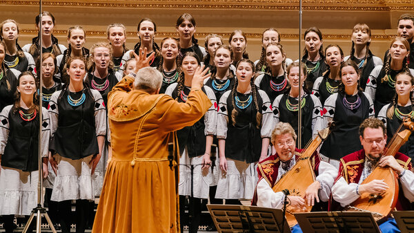 Oleh Mahlay, the artistic director of the Bandurist Choir, conducts members of the Ukrainian Bandurist Chorus of North America and Ukrainian Children's Choir at New York City's Carnegie Hall on Sunday.