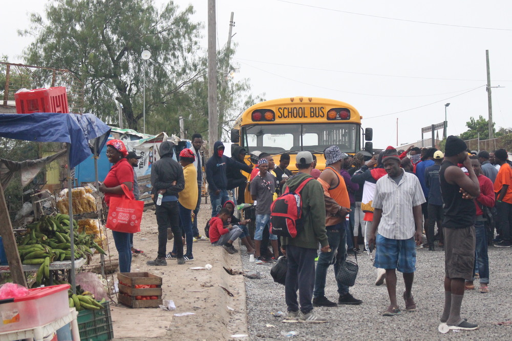 Haitian migrants gather outside a shelter in Reynosa, Mexico earlier this week. Immigration authorities are bracing for an influx of migrants when pandemic border restrictions end. (Carolina Cuellar/TPR)