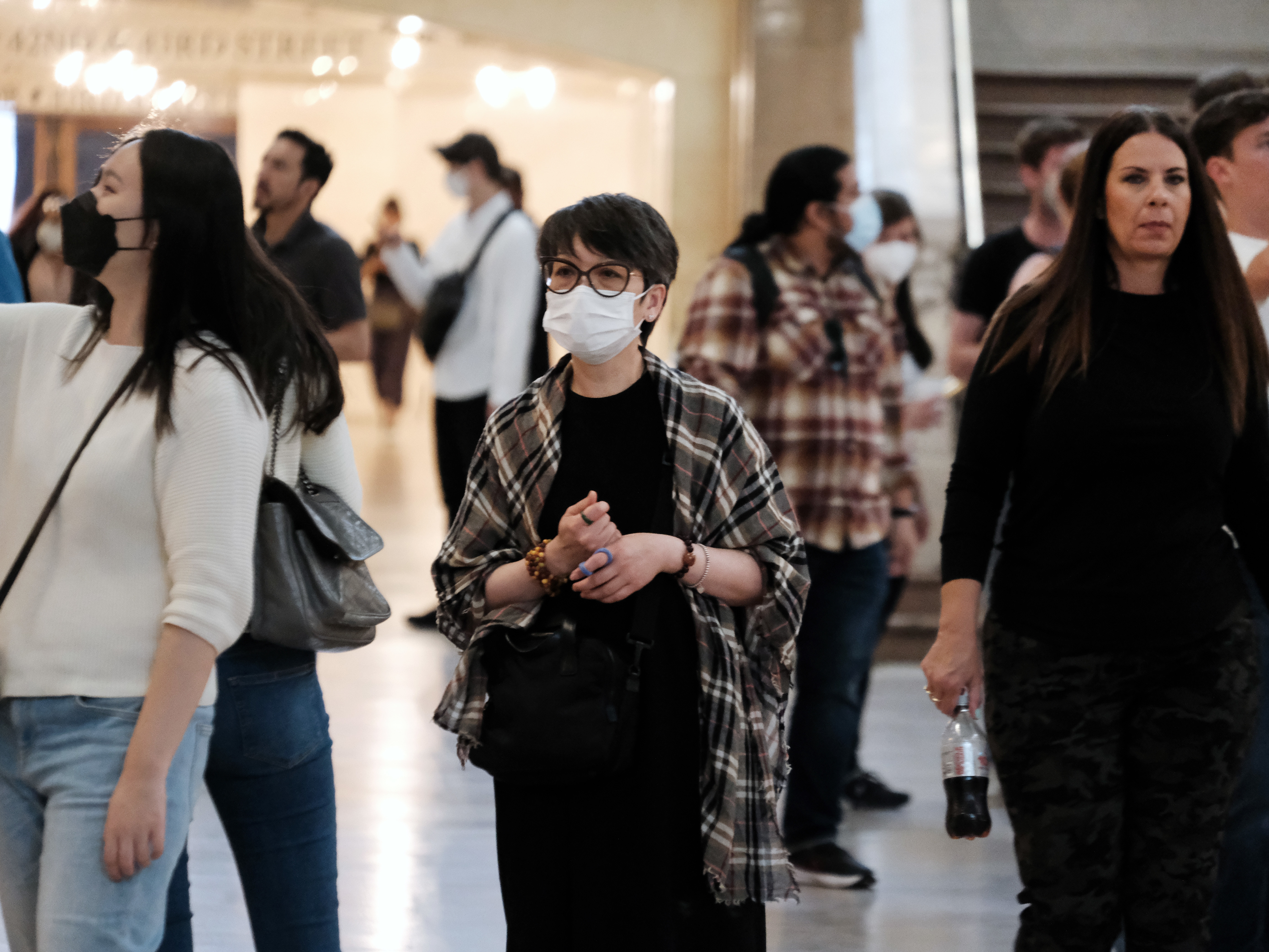A woman wears a mask indoors in Manhattan earlier this year, in New York City. The city's public health commissioner issued new guidance on Friday advising New Yorkers to wear face coverings in all public spaces. (Getty Images)