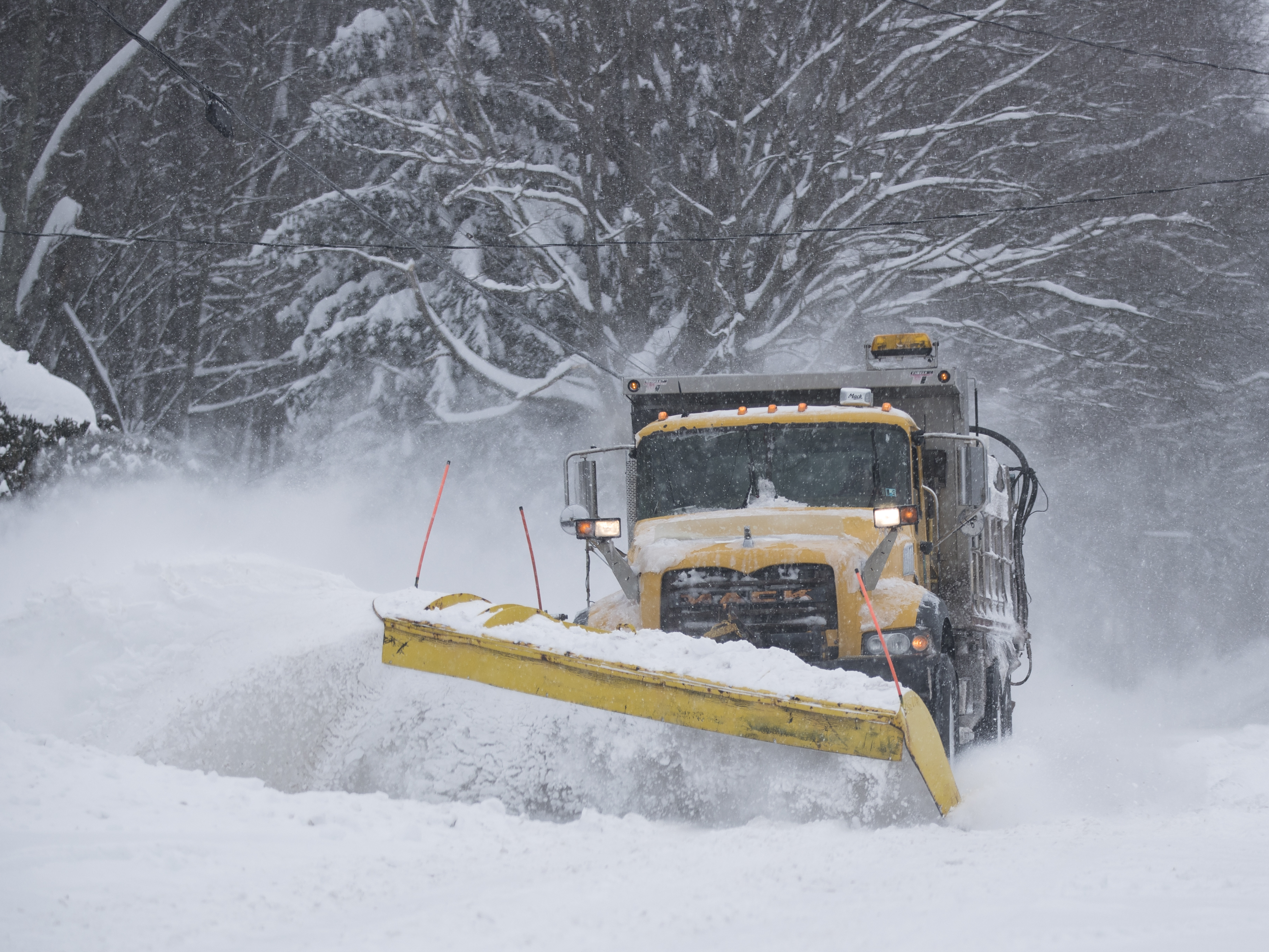 A PennDOT plow truck clears roads in northeastern Pennsylvania following snowfall of up to two feet on March 14, 2017, in Scranton. Around the country, people are participating in contests to give local snowplows clever names. (Getty Images)