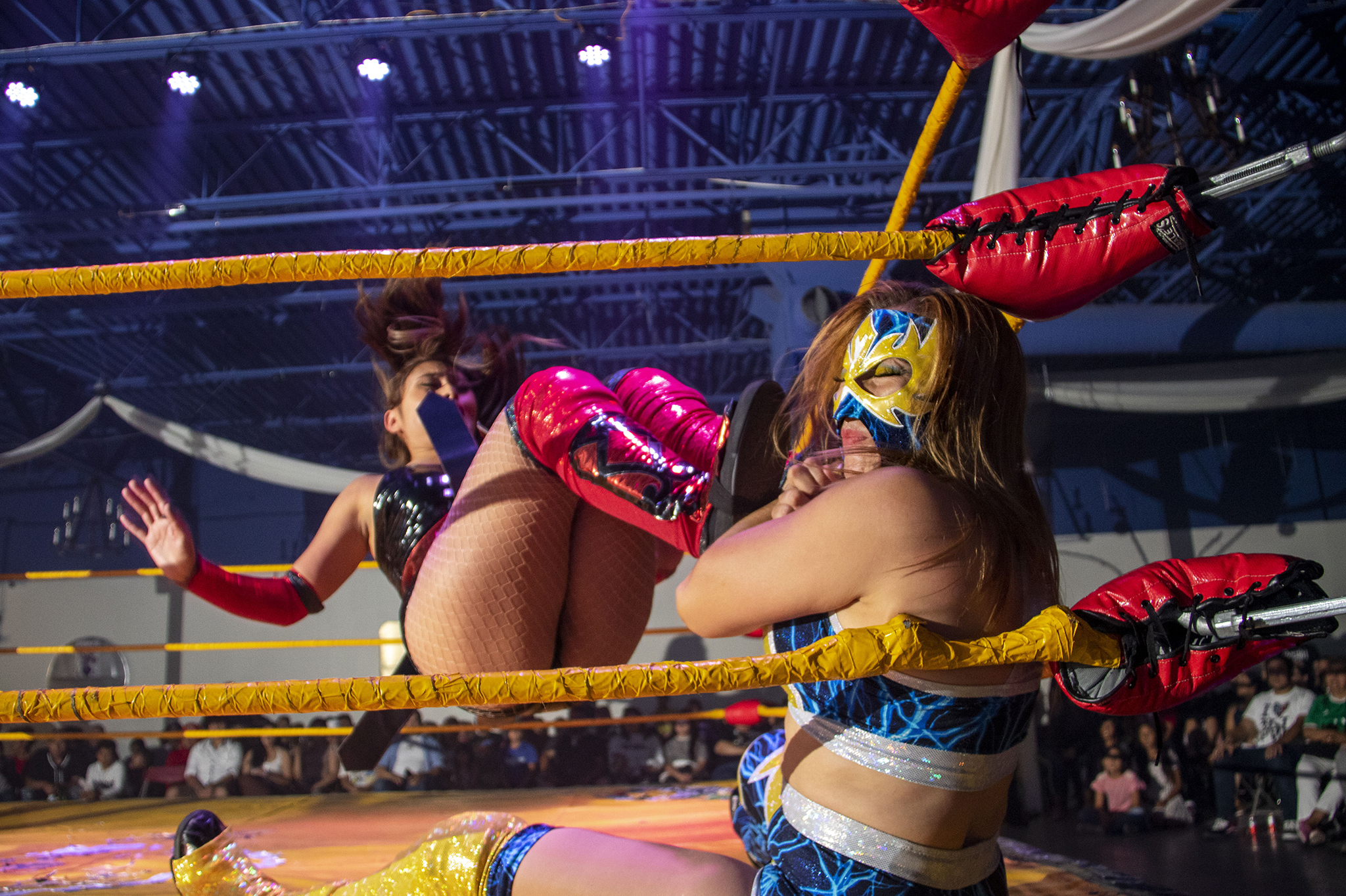 Athena Estrada drop-kicks Sakura during a lucha libra extravaganza in Aurora, Colorado. July 24, 2022.