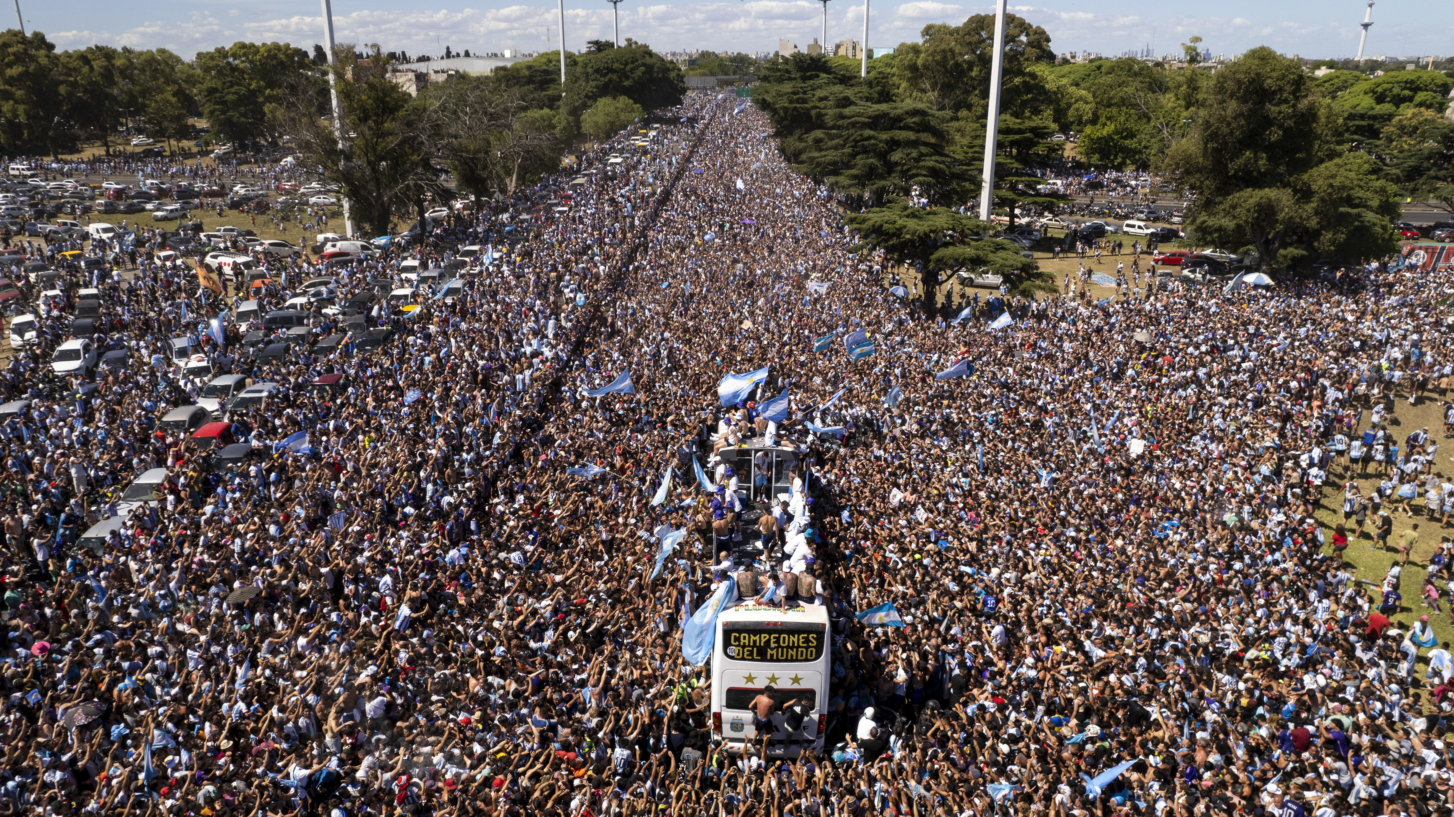 The Argentine soccer team that won the World Cup title ride on an open bus during their homecoming parade in Buenos Aires, Argentina, Tuesday, Dec. 20, 2022.