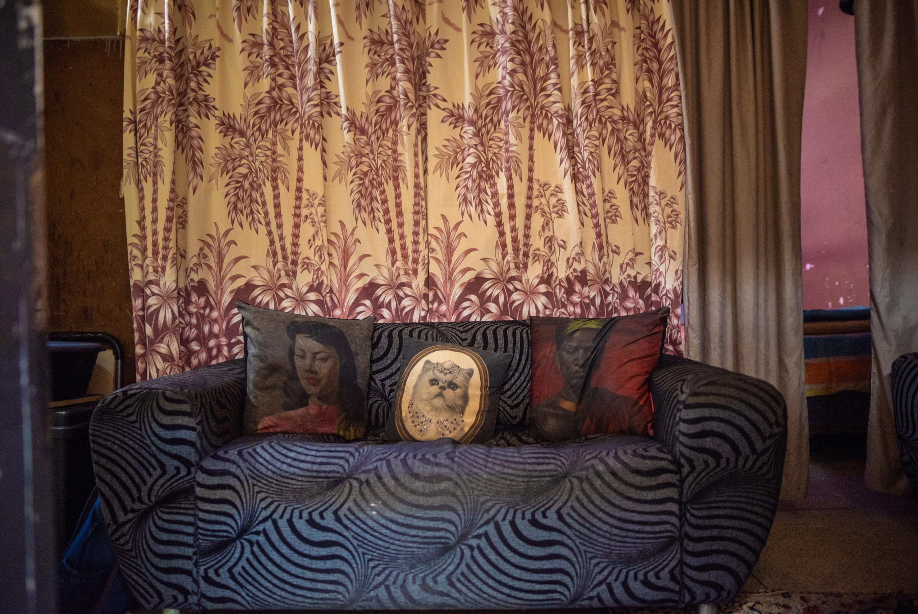 Inside South Africa's 'hijacked' buildings: 'All we want is a place to call home' 8 A sofa in the home of Elizabeth Daniels and her family in Cissie Gool House. Many residents have used furniture to create seperate living spaces in former in-patient accommodations and consulting rooms.