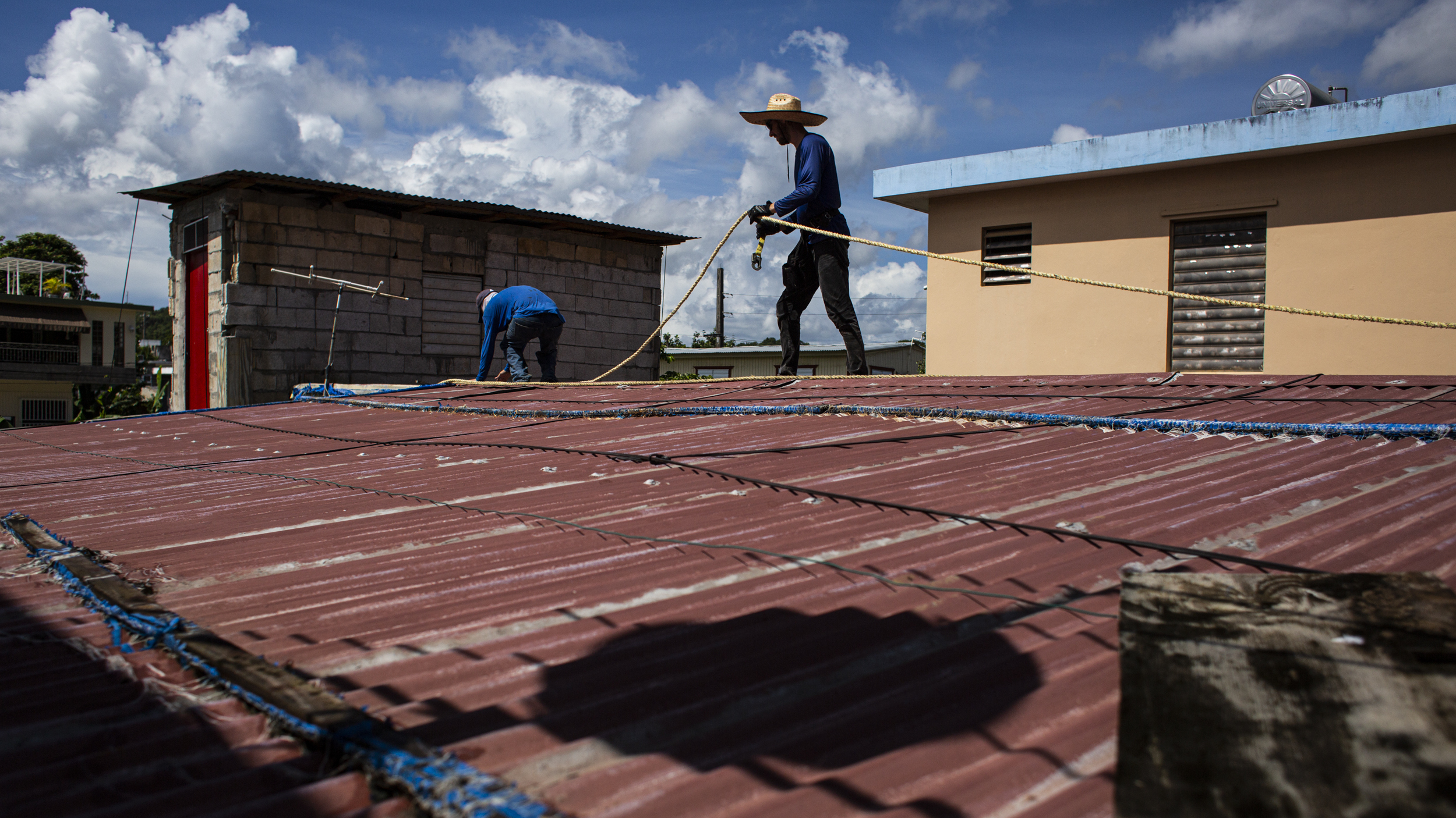 Hurricane-damaged roofs in Puerto Rico remain a problem. One group is offering a fix.