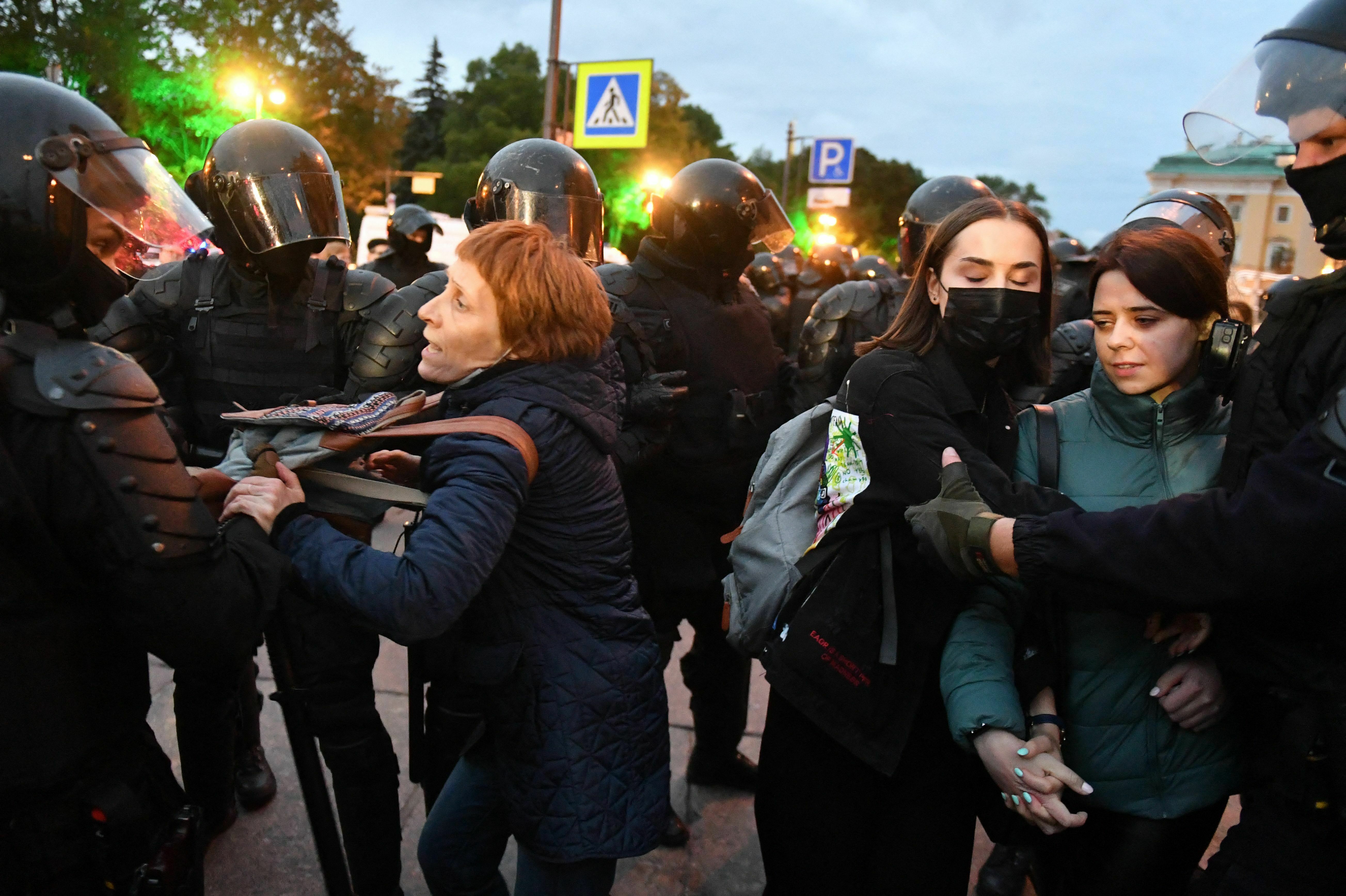Police officers detain demonstrators in St. Petersburg, Russia, on Sept. 21, following calls to protest against the partial mobilization announced by President Vladimir Putin. Putin called on Russian military reservists, saying his promise to use all military means in Ukraine was &quot;no bluff,&quot; and hinting that Moscow was prepared to use nuclear weapons. (Olga Maltseva/AFP/Getty Images)
