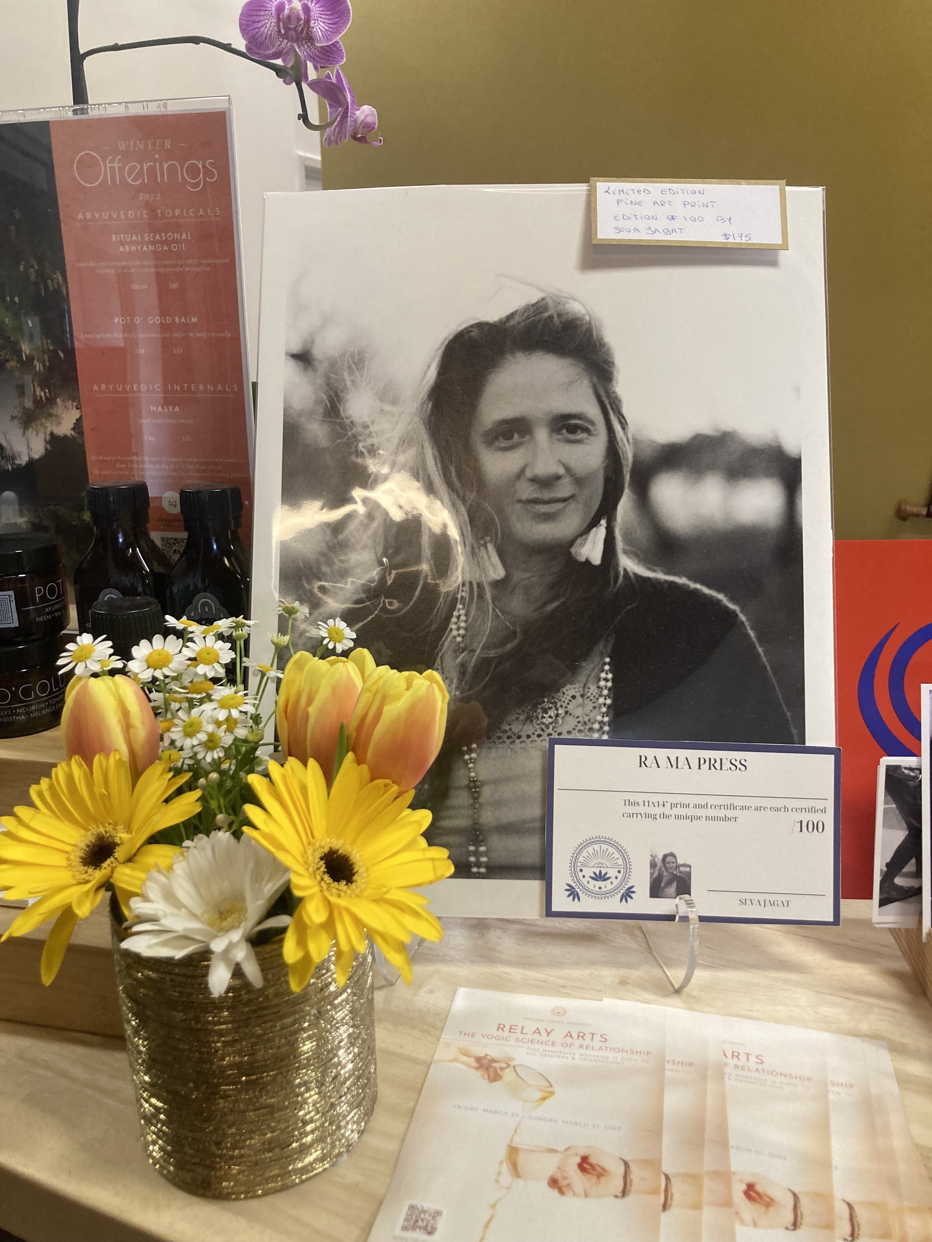 Photo prints of the late Guru Jagat for sale at the RA MA Santa Monica yoga studio. (KPCC/LAist)