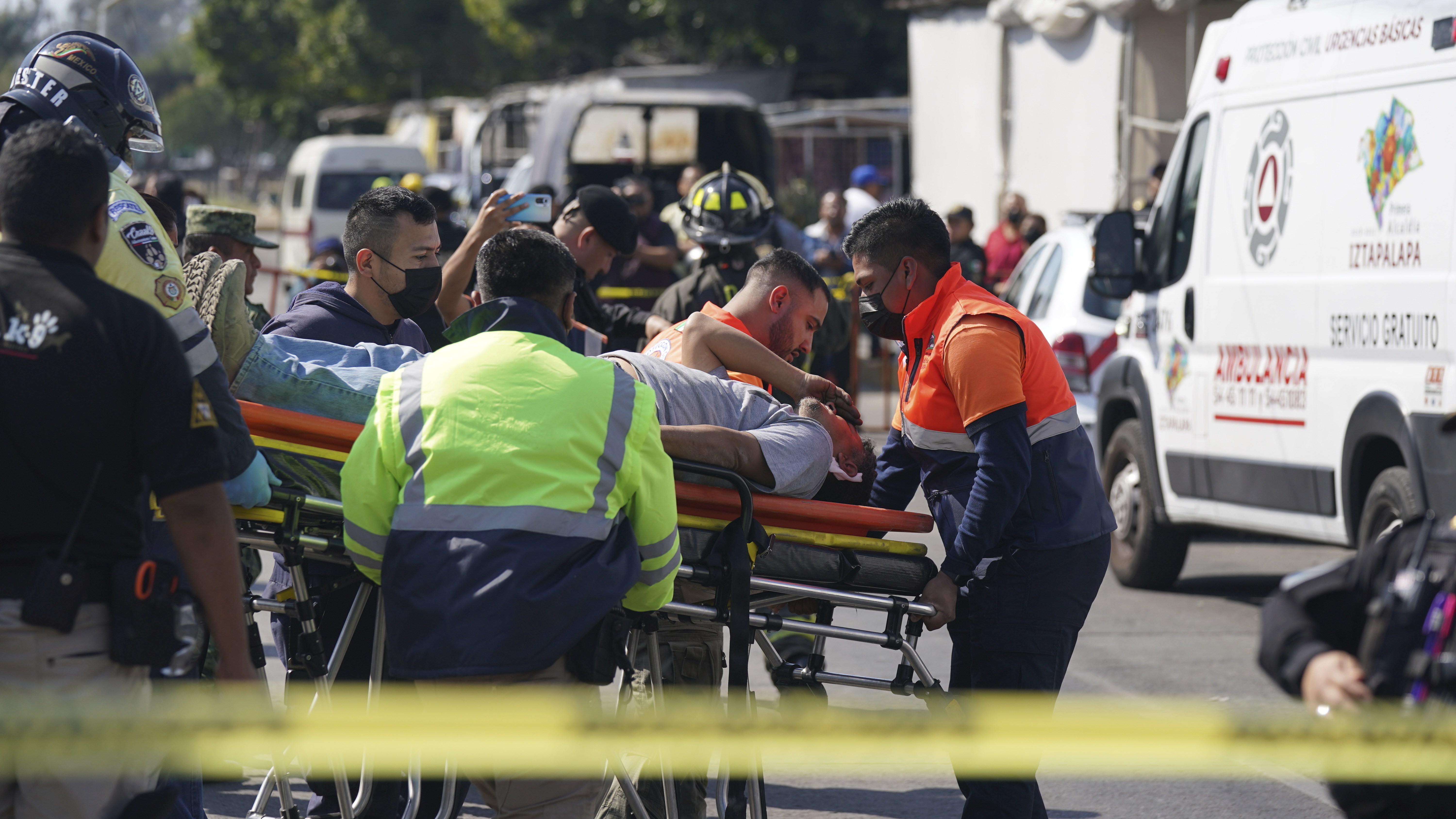 A subway passenger, injured when two subway trains collided, is taken on a stretcher to a waiting ambulance, outside the Raza station in Mexico City, on Saturday.