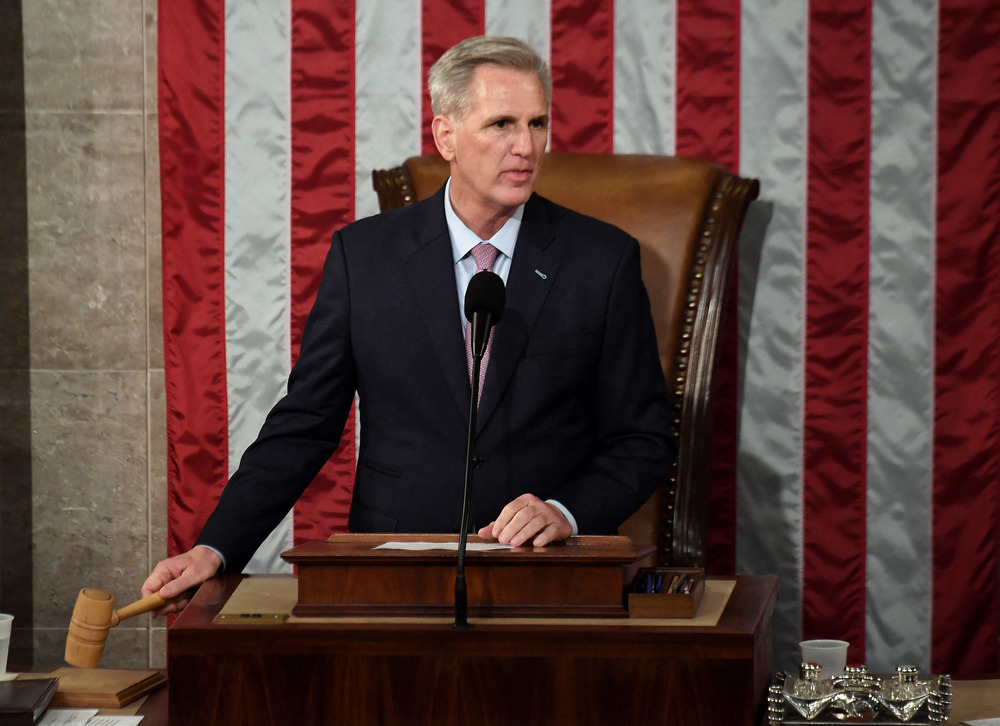 Newly elected House Speaker Kevin McCarthy holds the gavel after he was elected early Saturday on the 15th ballot. (AFP via Getty Images)