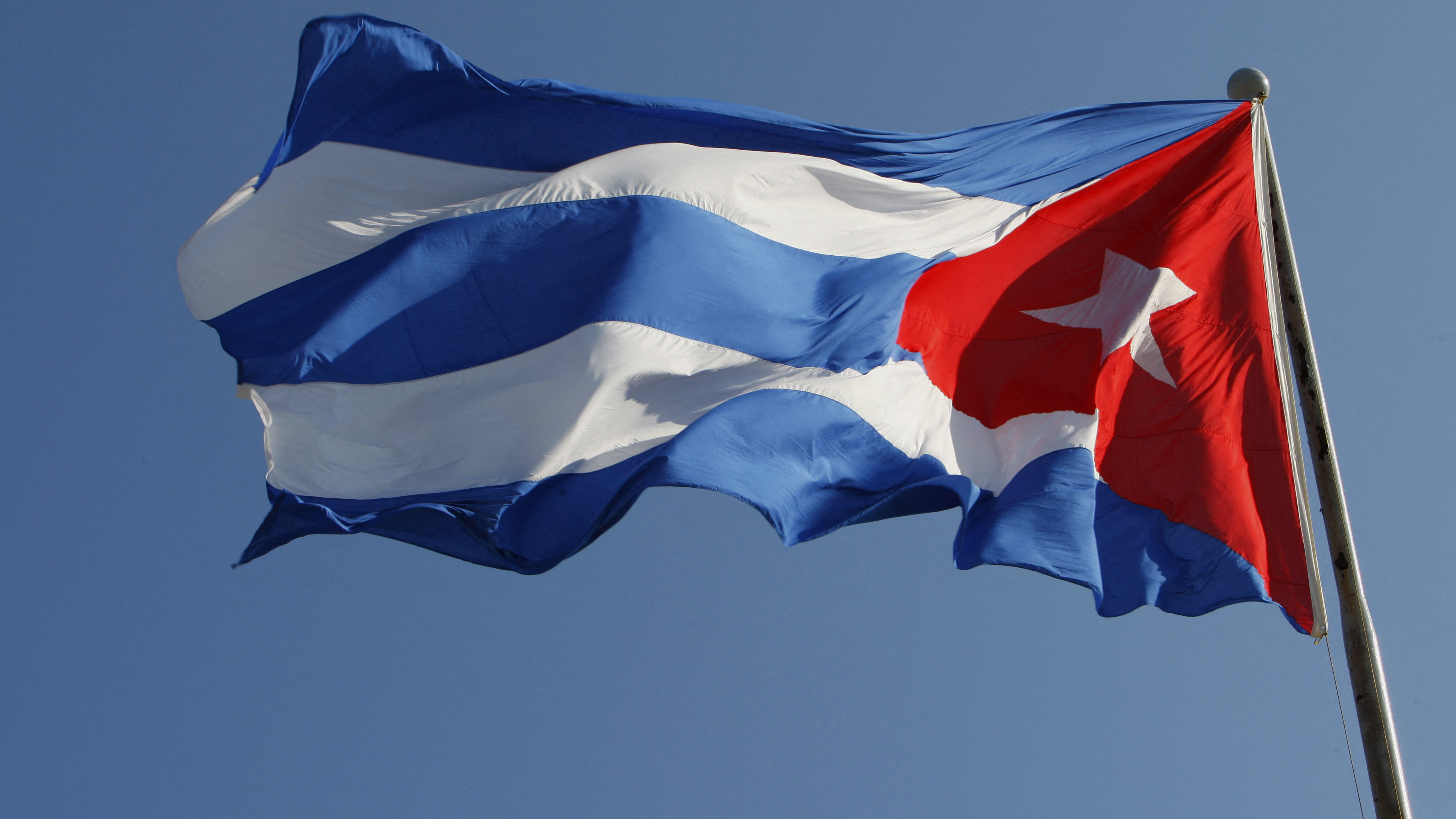 A Cuban flag flutters above Revolution Square in Havana, on February 8, 2008.