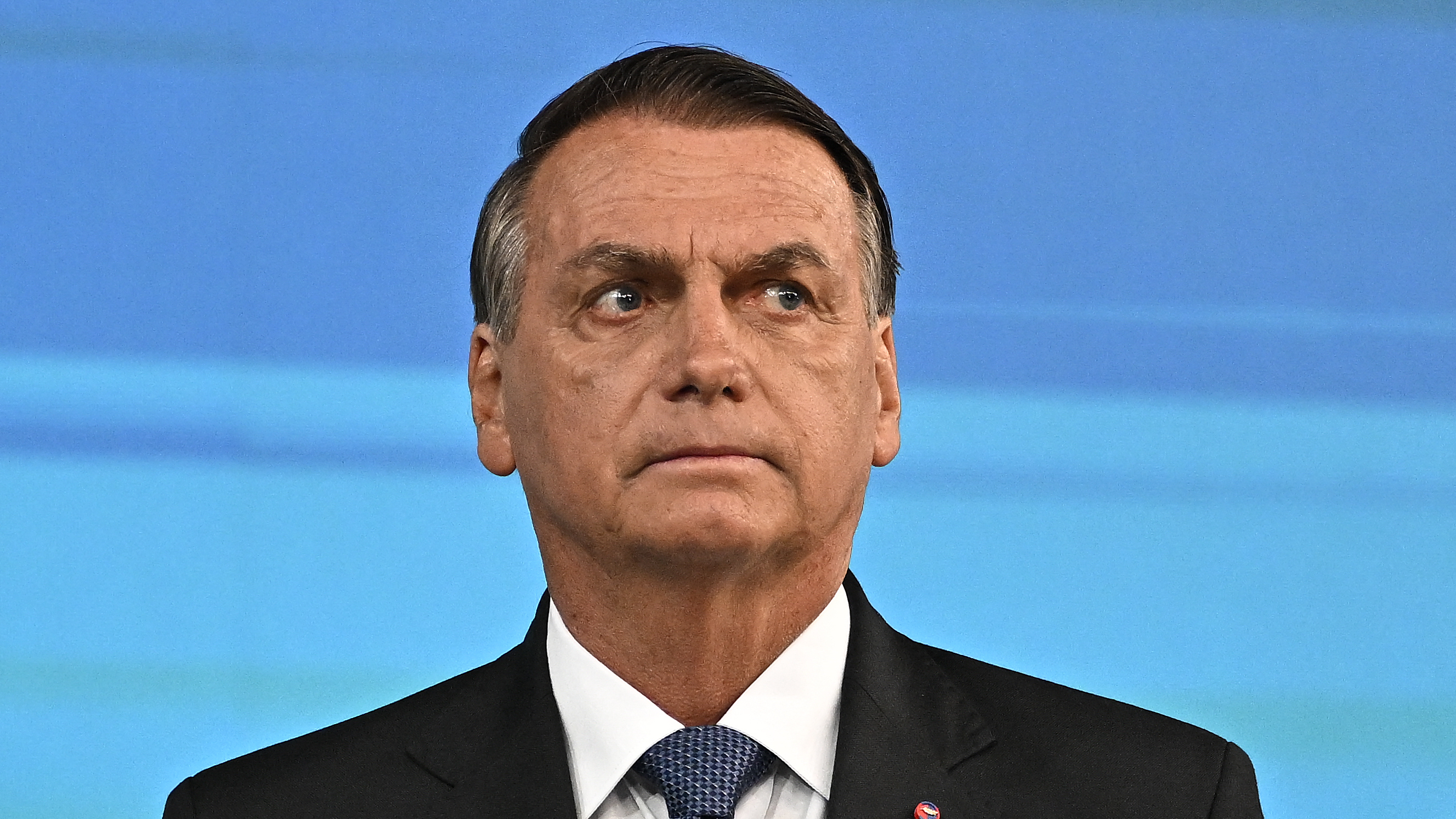 Former Brazilian President Jair Bolsonaro, pictured here at an election debate in October, left his country for Florida two days before his term ended.