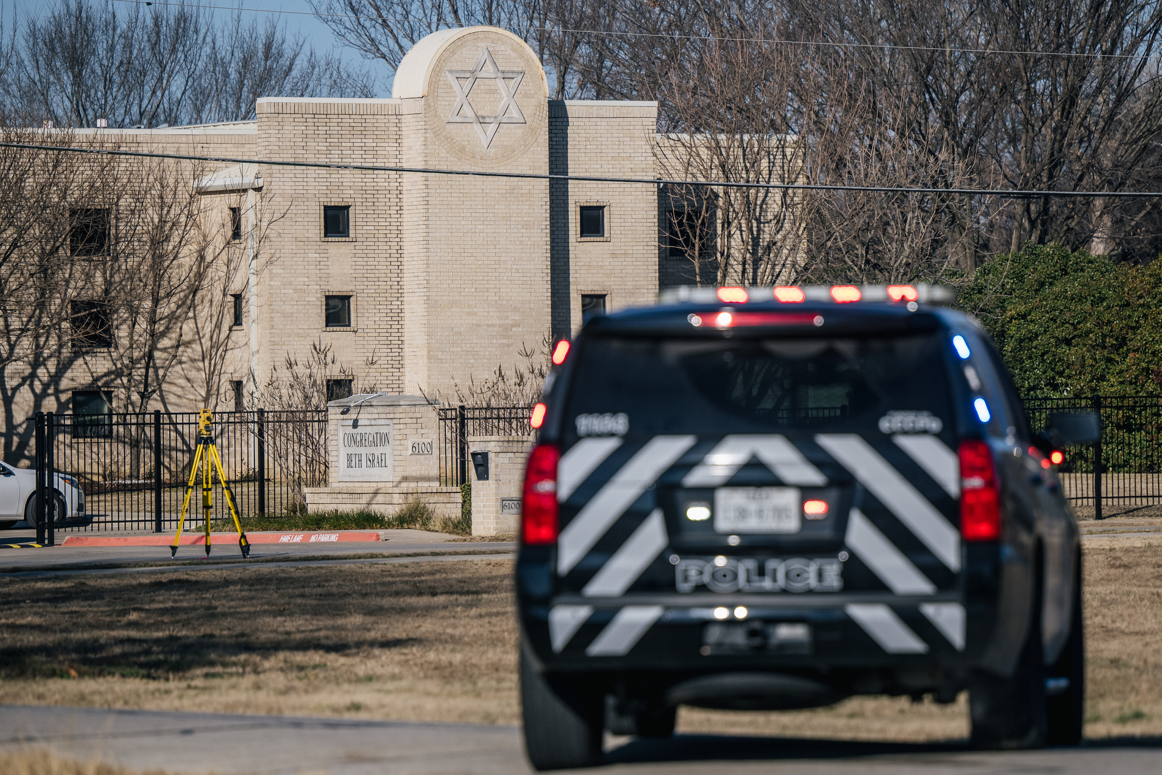 A police vehicle sits near the Congregation Beth Israel synagogue in Colleyville, Texas, on Jan. 16, 2022. Four people were held hostage at the synagogue for more than 10 hours by a gunman before being freed, one of a spate of antisemitic acts that took place last year.