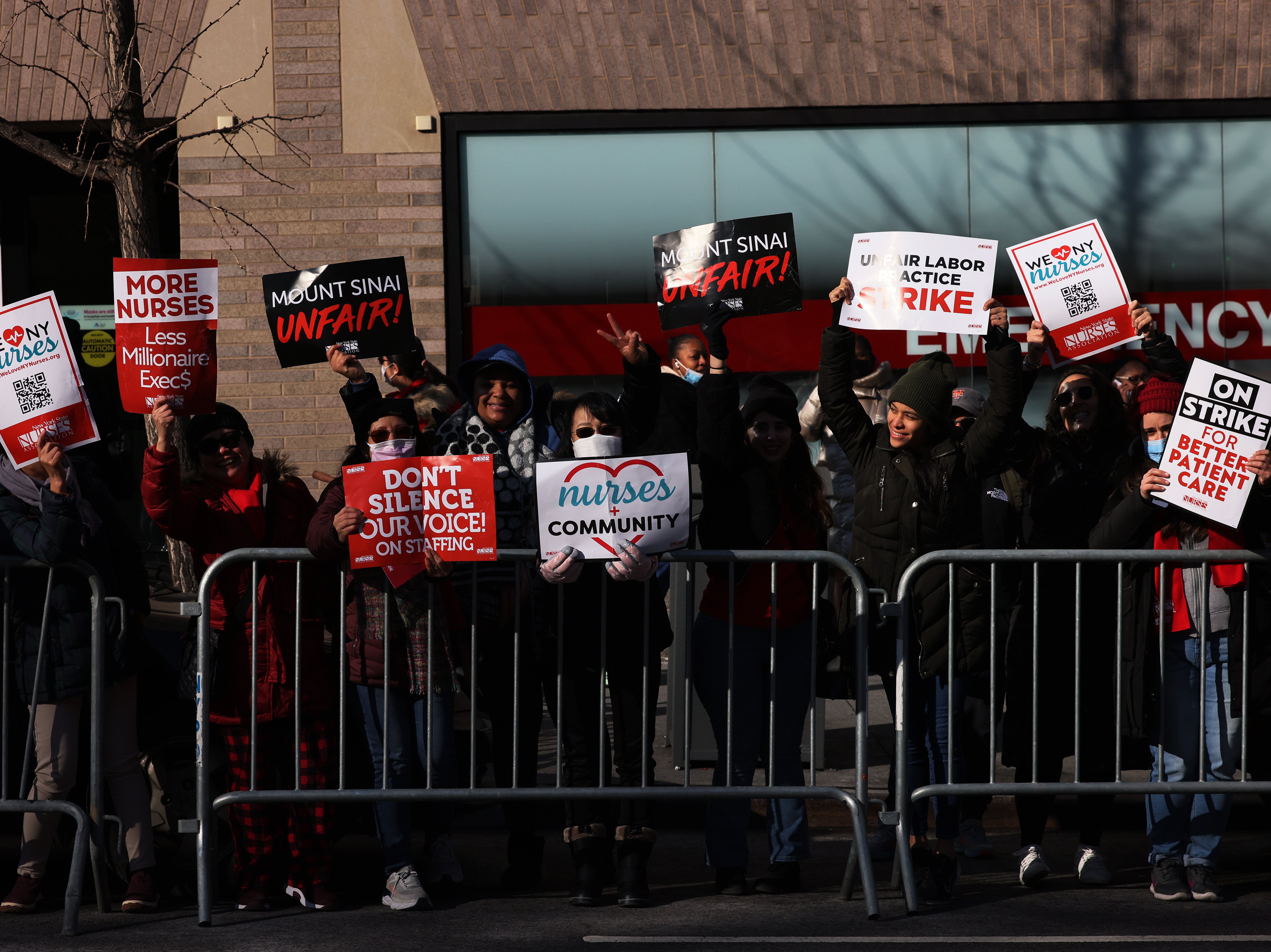 Nurses hold signs outside Manhattan's Mount Sinai Hospital on Monday, the first day of their strike. (Getty Images)