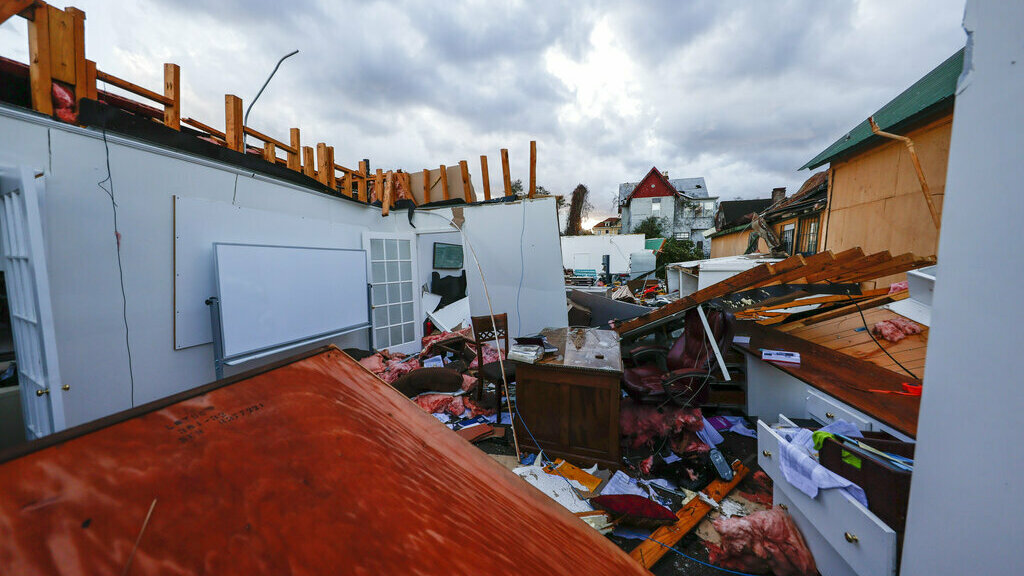 Debris litters a local business that was destroyed Thursday by a tornado that passed through downtown Selma Ala.