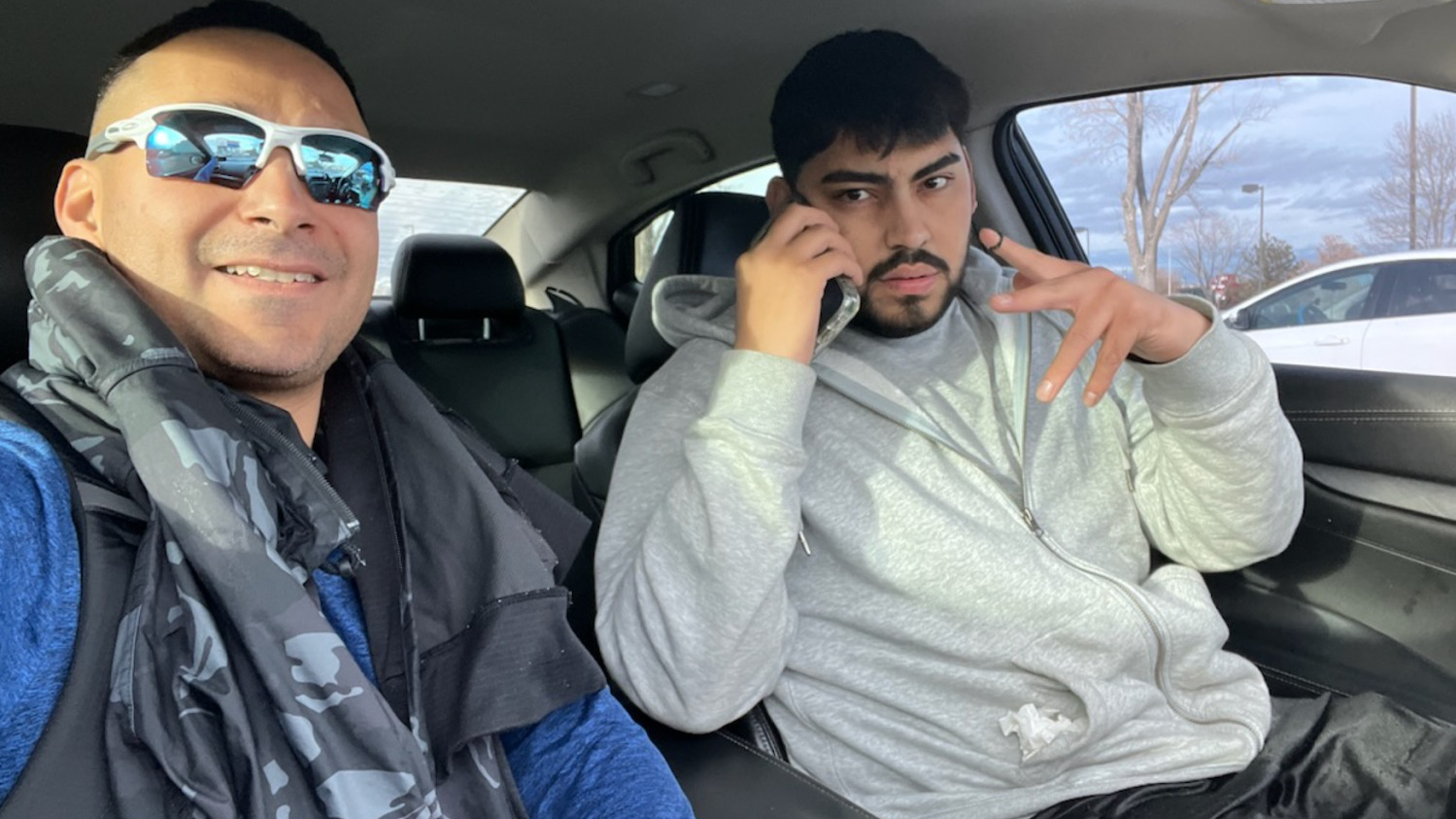 Police say that Solomon Peña, left, sent a co-conspirator this image showing himself in a car with José Trujillo, an accused gunman in several drive-by shooting attacks on Democratic officials